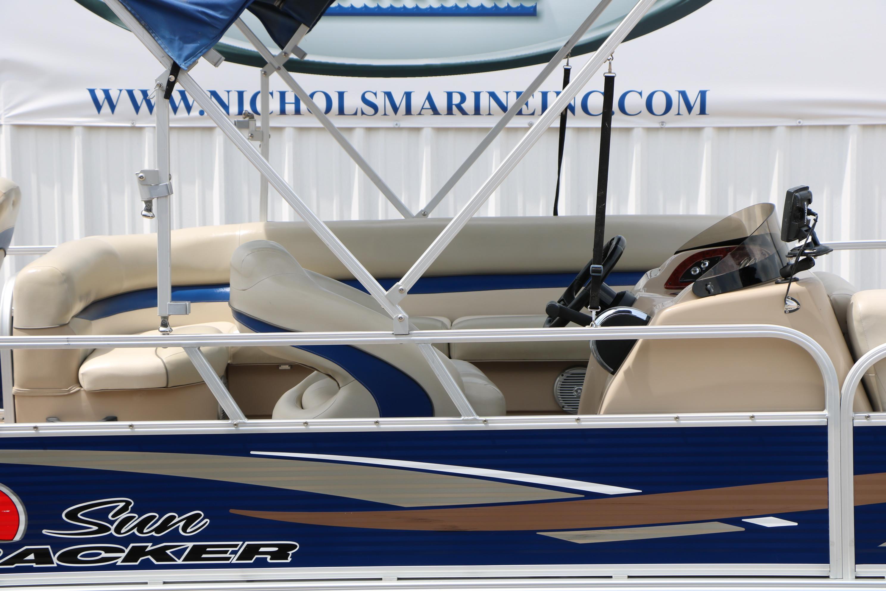 2013 Sun Tracker Fishin' Barge 20 DLX pontoon boat interior with steering console.