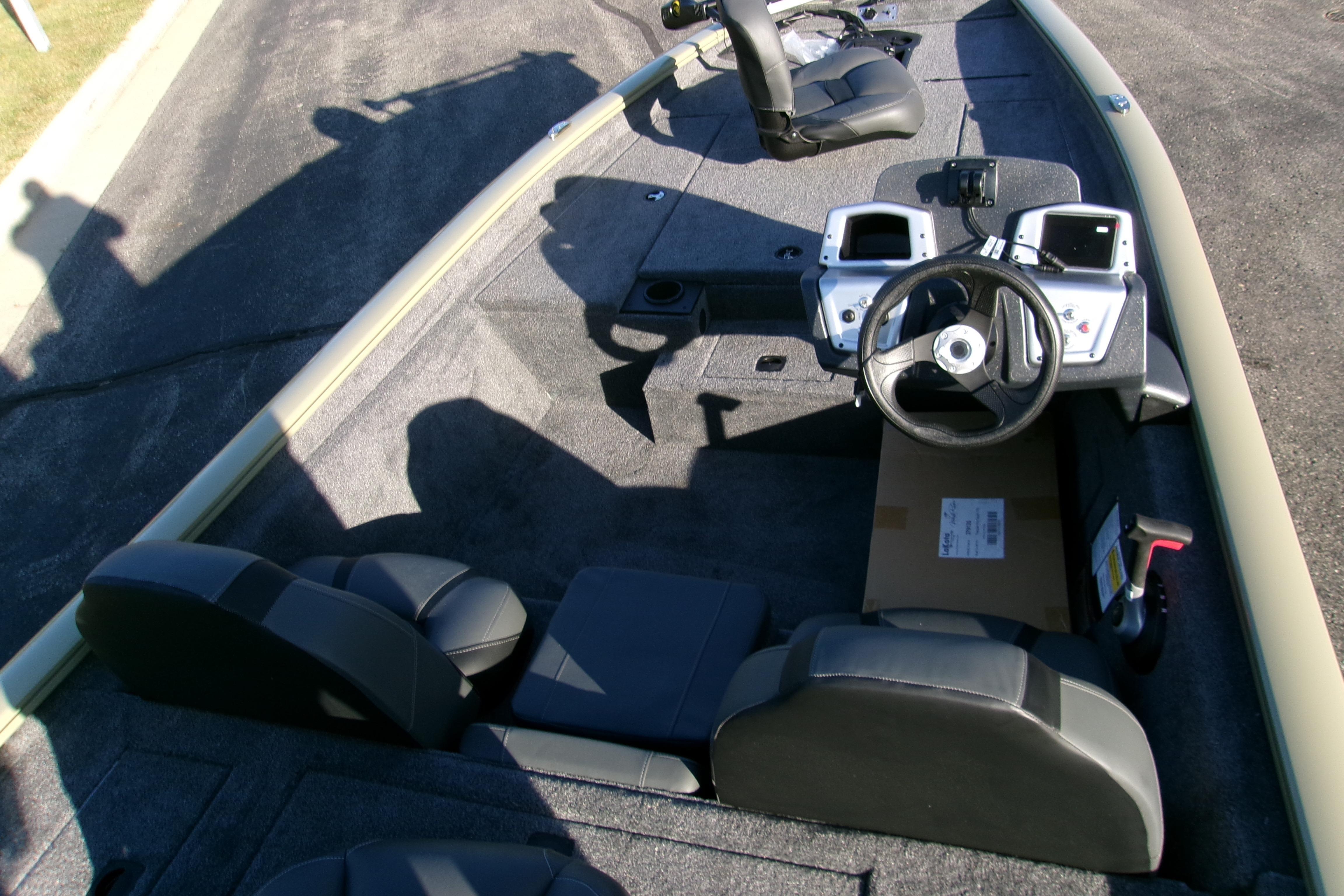 2026 Tracker Pro Team 175 Crappie Edition boat interior with steering wheel and seating.
