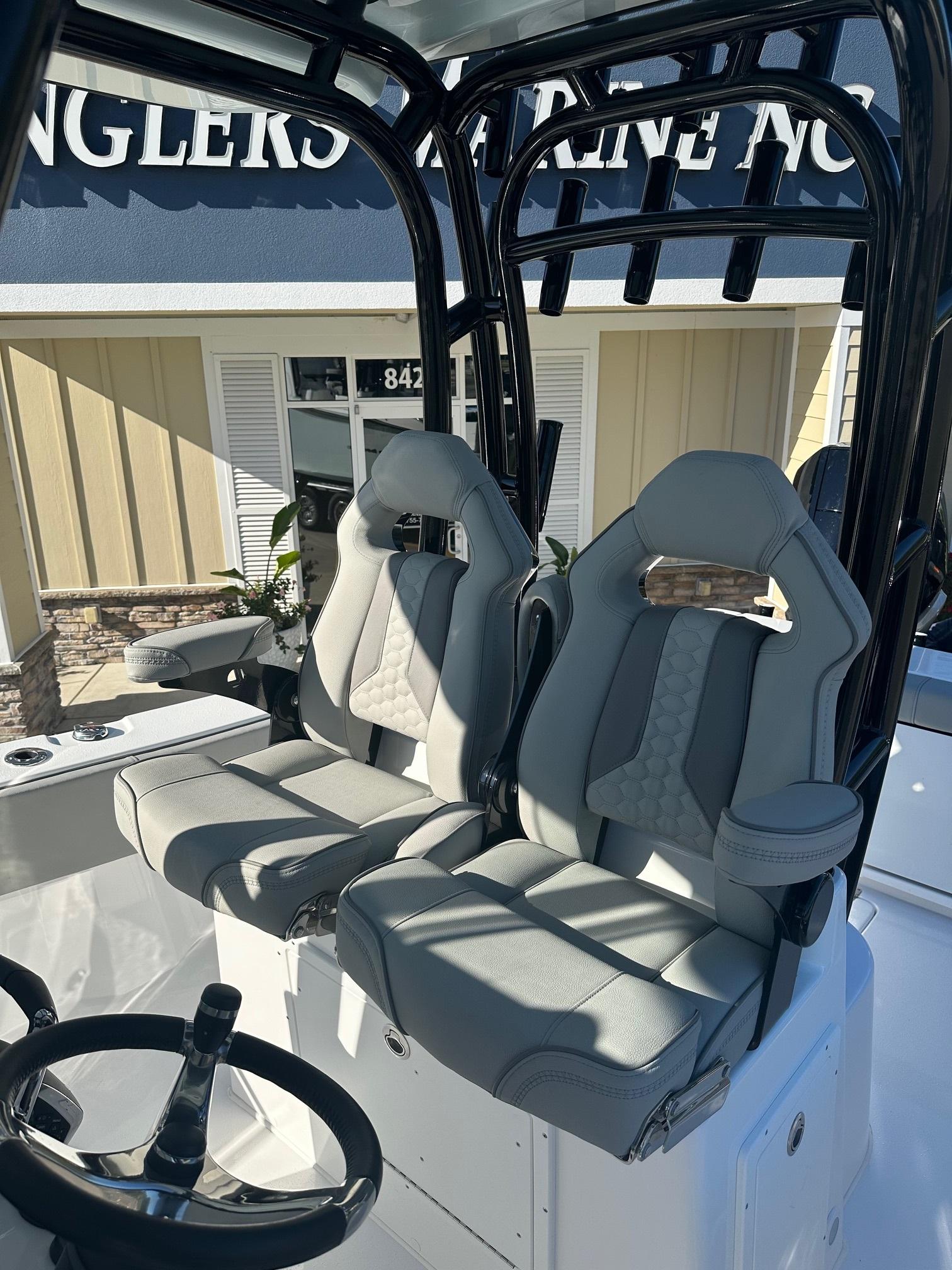 2025 Cape Horn 28XS boat interior with dual gray seats and steering wheel.