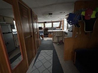 Interior of a 1993 Gibson Sport Series yacht with kitchen and seating area.