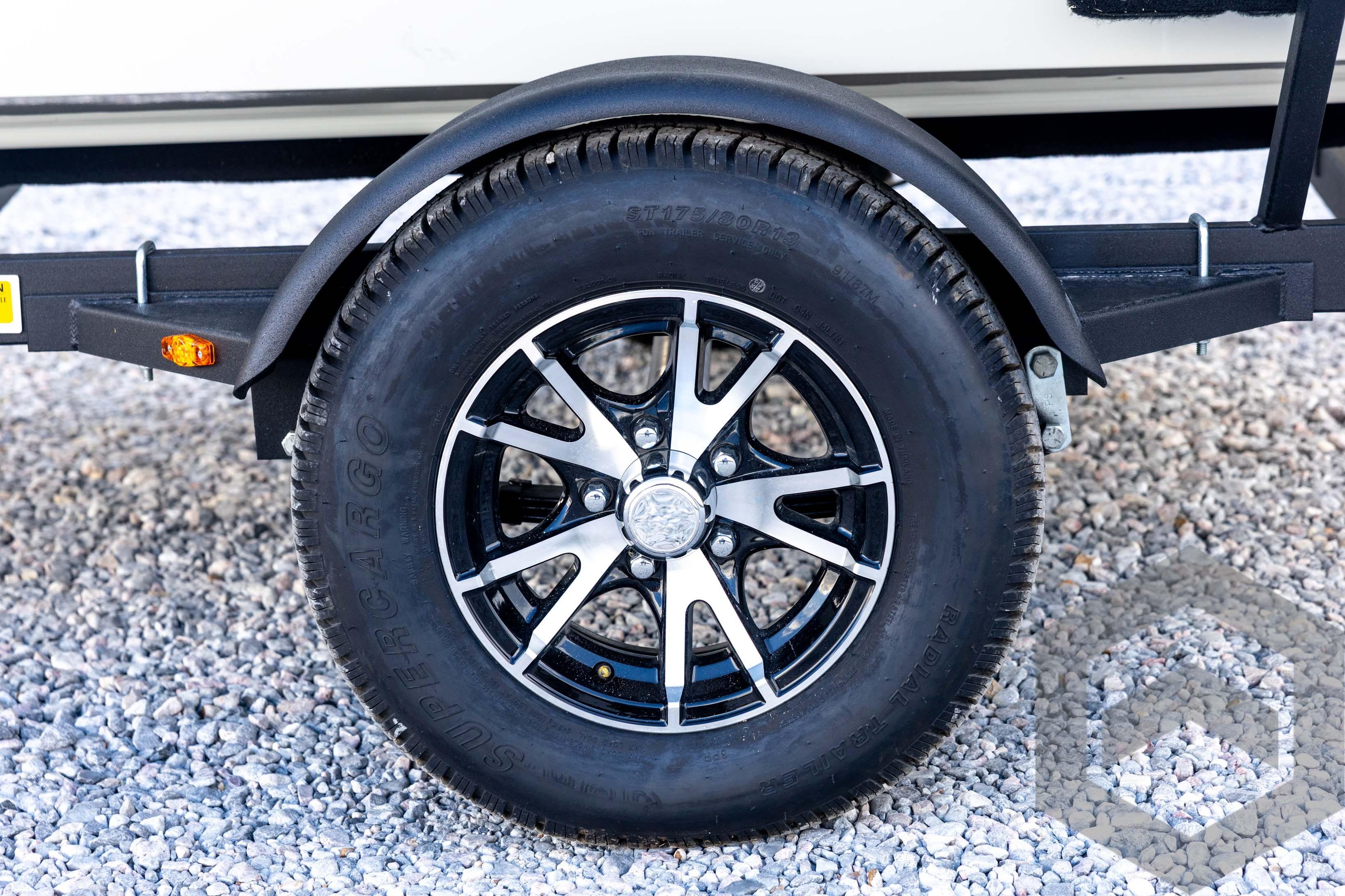 2026 G3 Sportsman 1710 SE trailer wheel on gravel surface.