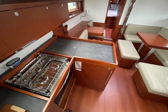 Interior of 2018 Beneteau Oceanis 45 yacht with modern kitchen and seating area.