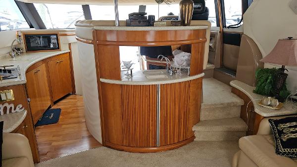 Interior of 2000 Carver 450 Voyager Pilothouse with wood cabinetry and modern amenities.