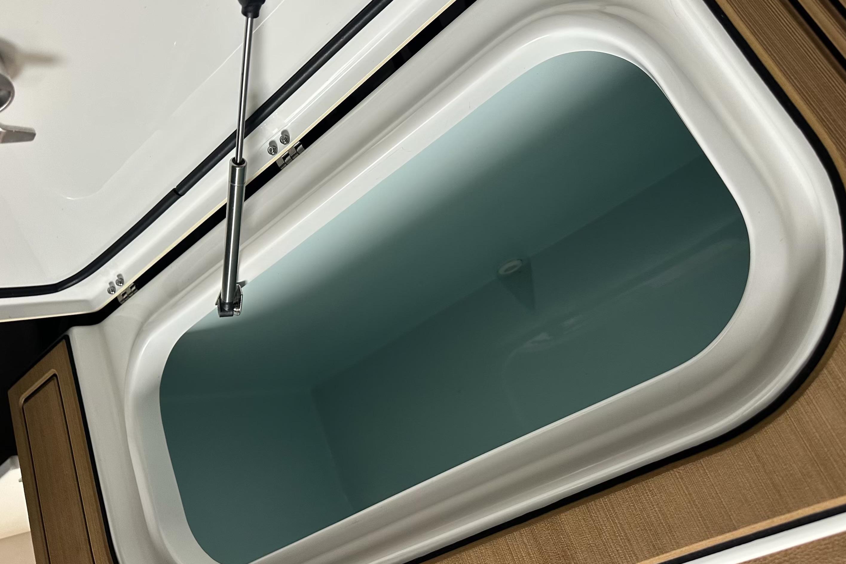 Open storage compartment on a 2019 Sea Hunt Gamefish 25 boat.