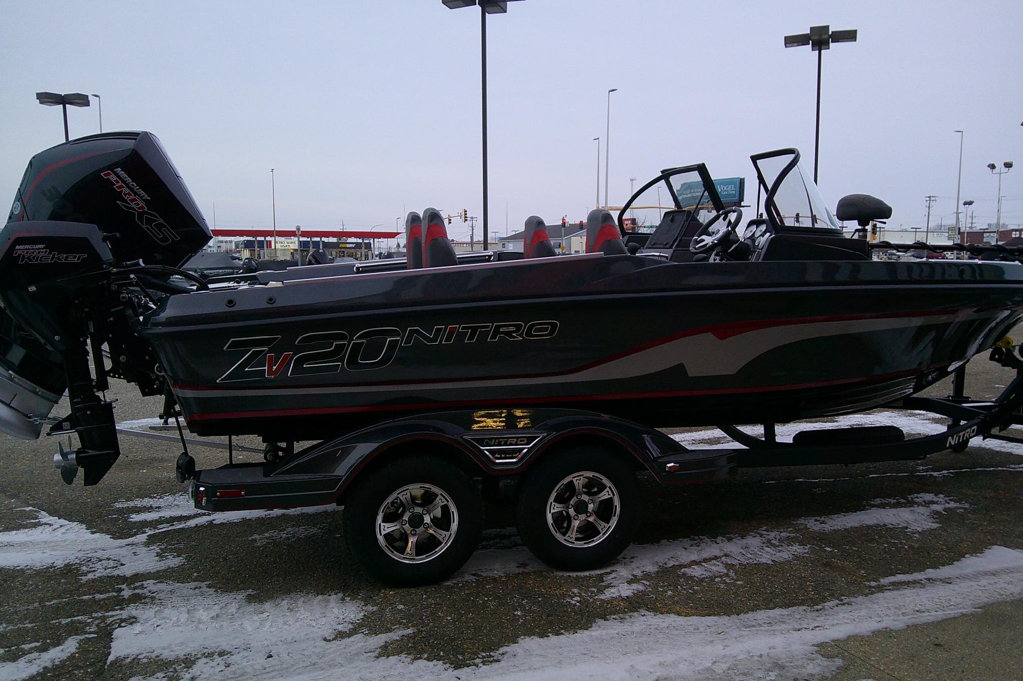 2026 Nitro ZV20 Pro fishing boat on trailer in snowy parking lot.