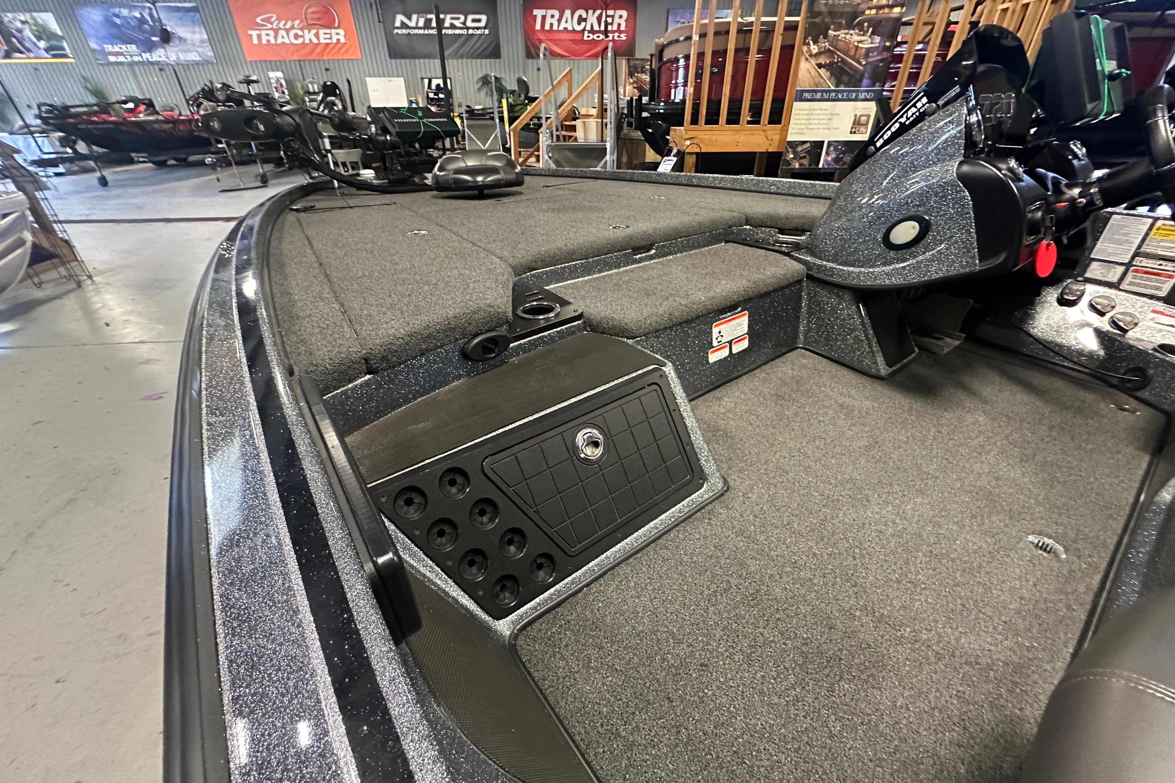 2018 Nitro Z20 Pro fishing boat interior with carpeted deck and storage compartments.