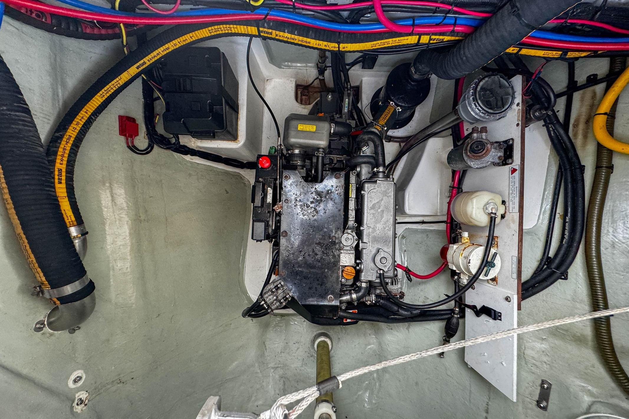 Engine compartment of a 2016 Leopard 48 yacht, showcasing wiring and mechanical components.