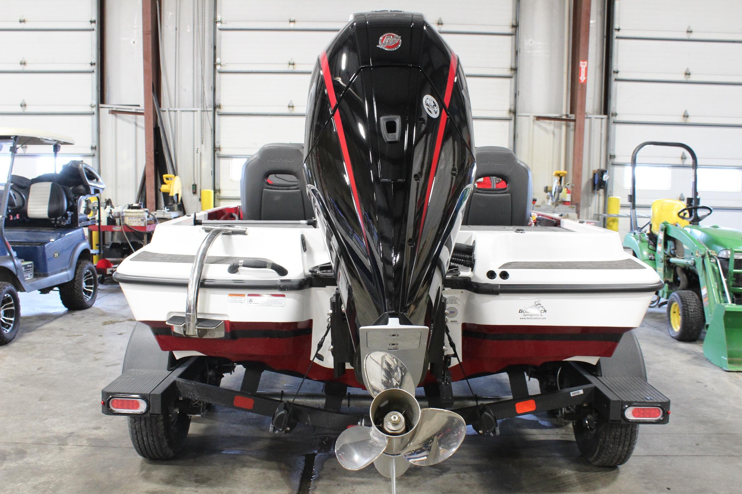 2026 Nitro Z19 XL Pro boat in a garage, showcasing its powerful outboard motor.