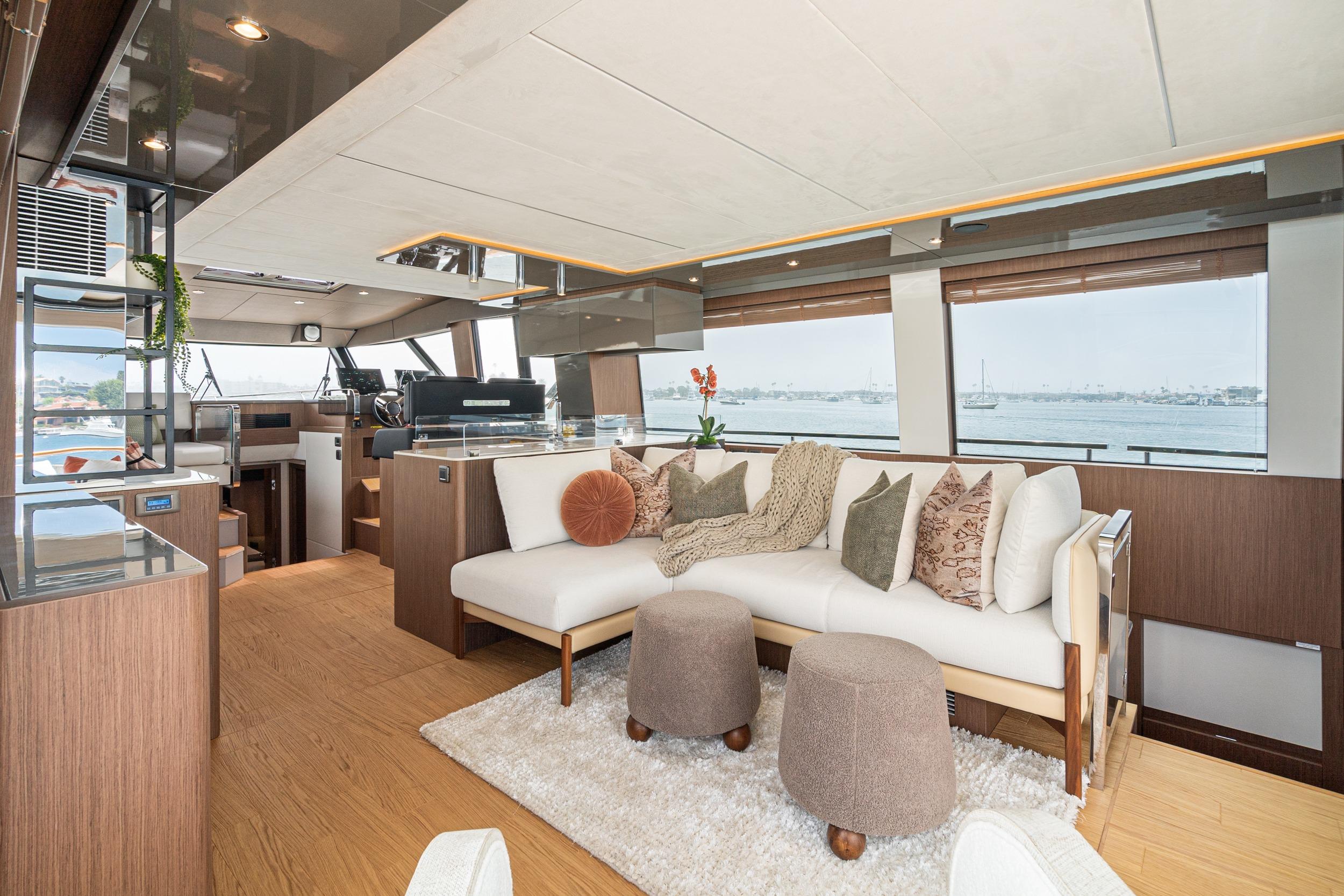 Luxurious interior of 2024 Prestige X60 yacht with elegant seating and panoramic windows.