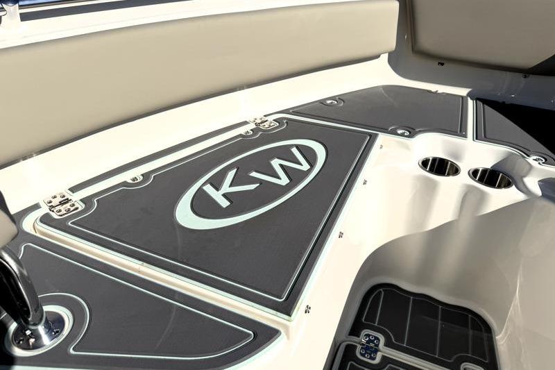 2025 Key West 239 FS boat interior with KW logo and cup holders.