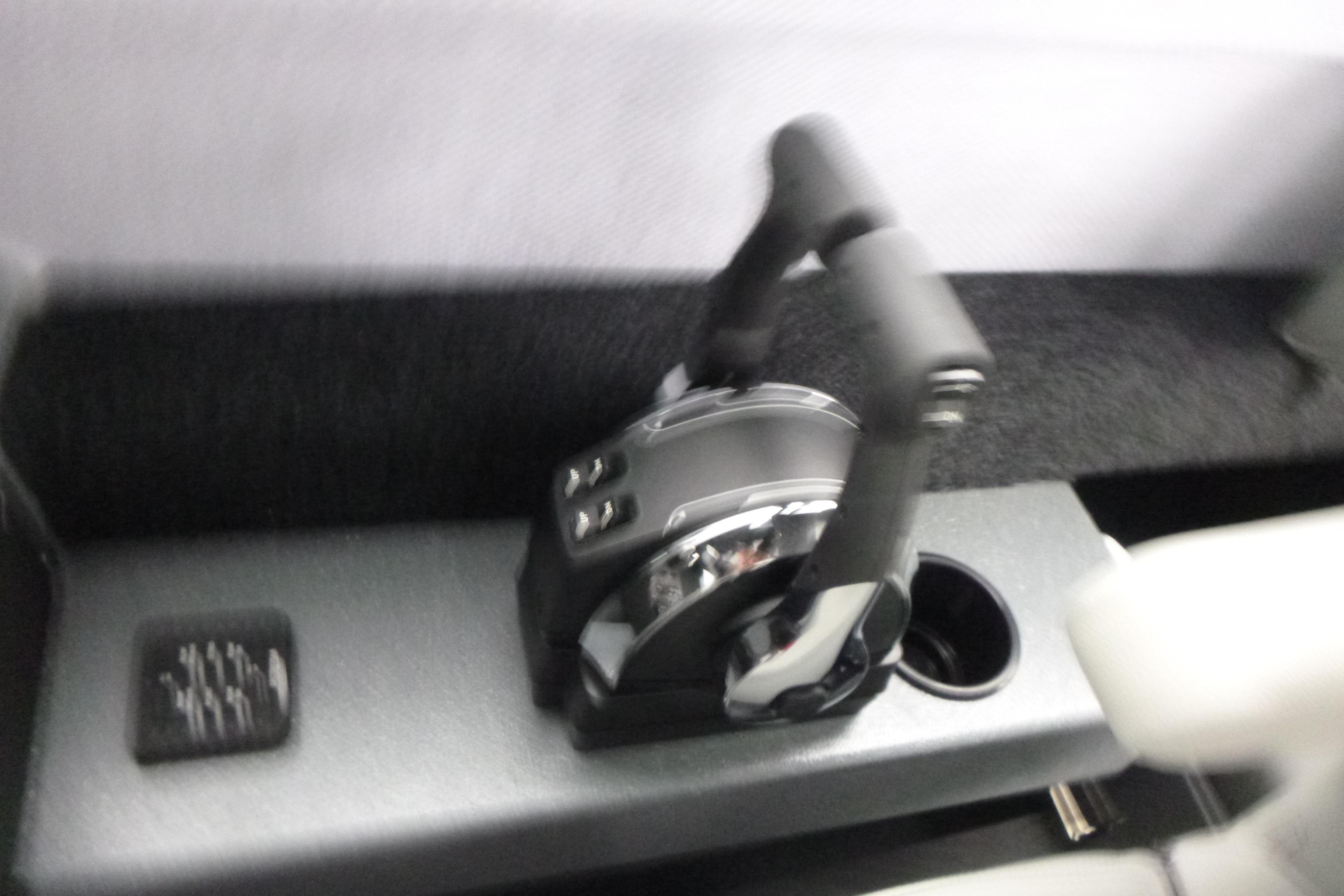 Control lever of 2026 KingFisher 25 XAC boat, featuring modern design and functionality.