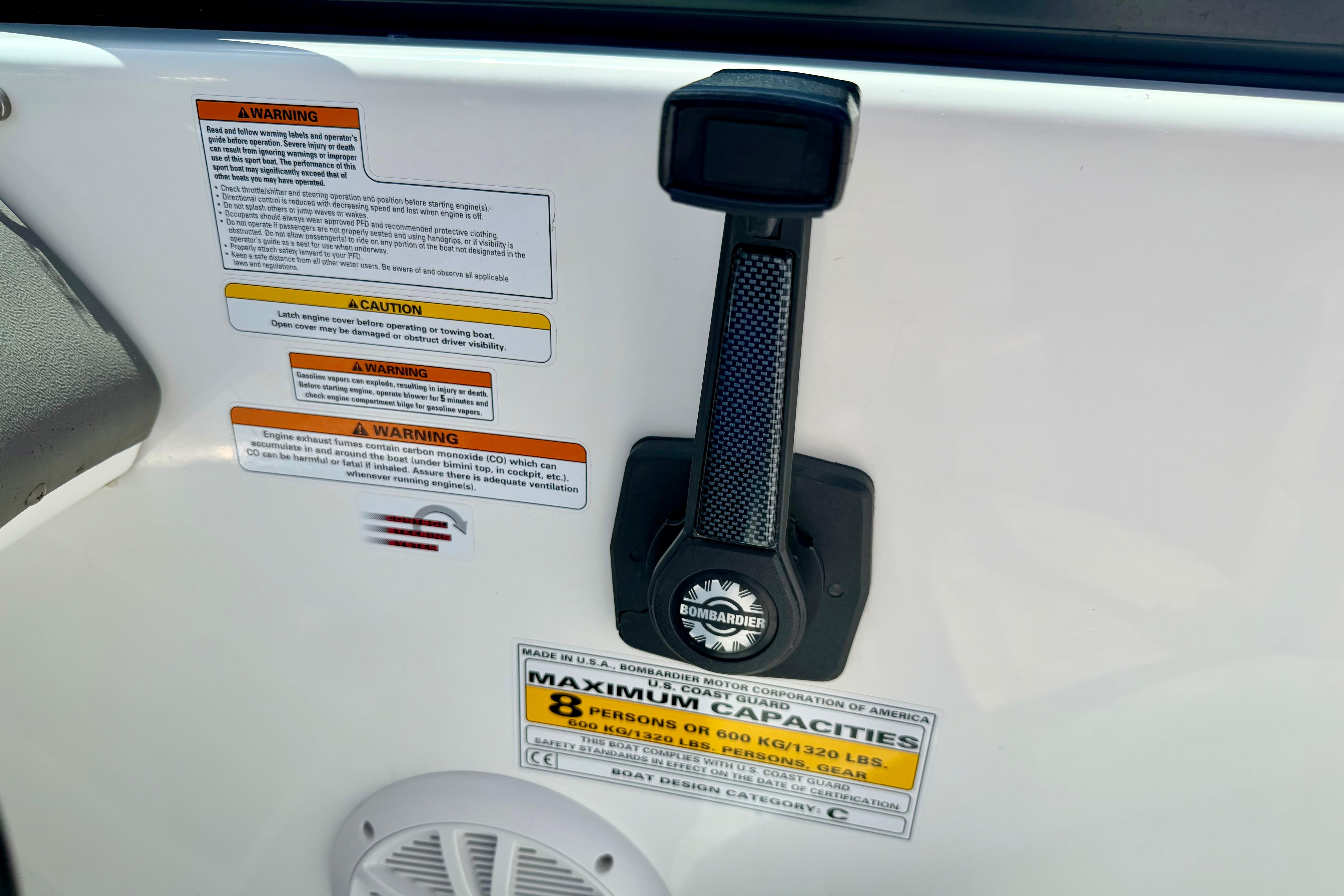 2004 Bombardier SEADOO Utopia 185 warning labels and capacity information on boat interior.