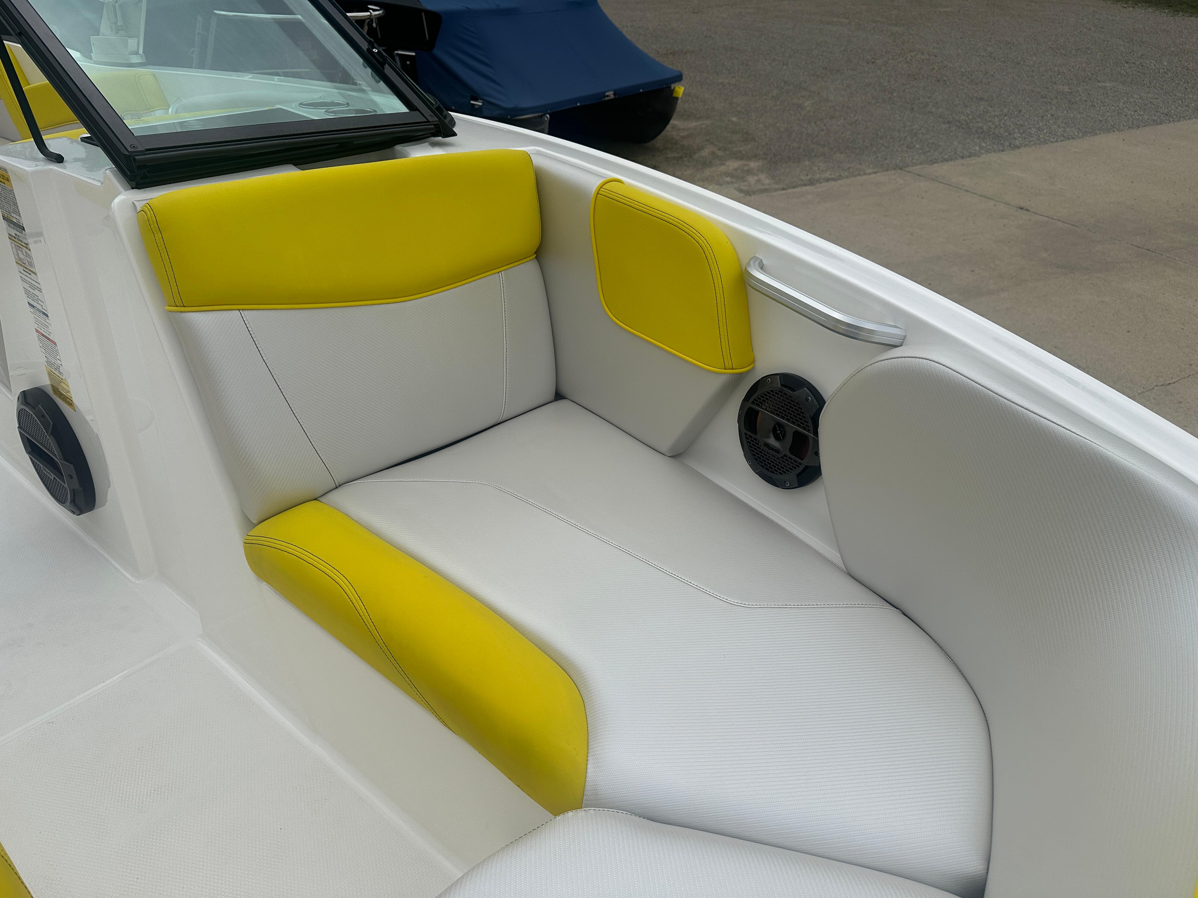 2018 MasterCraft NXT22 boat interior with yellow and white seating.