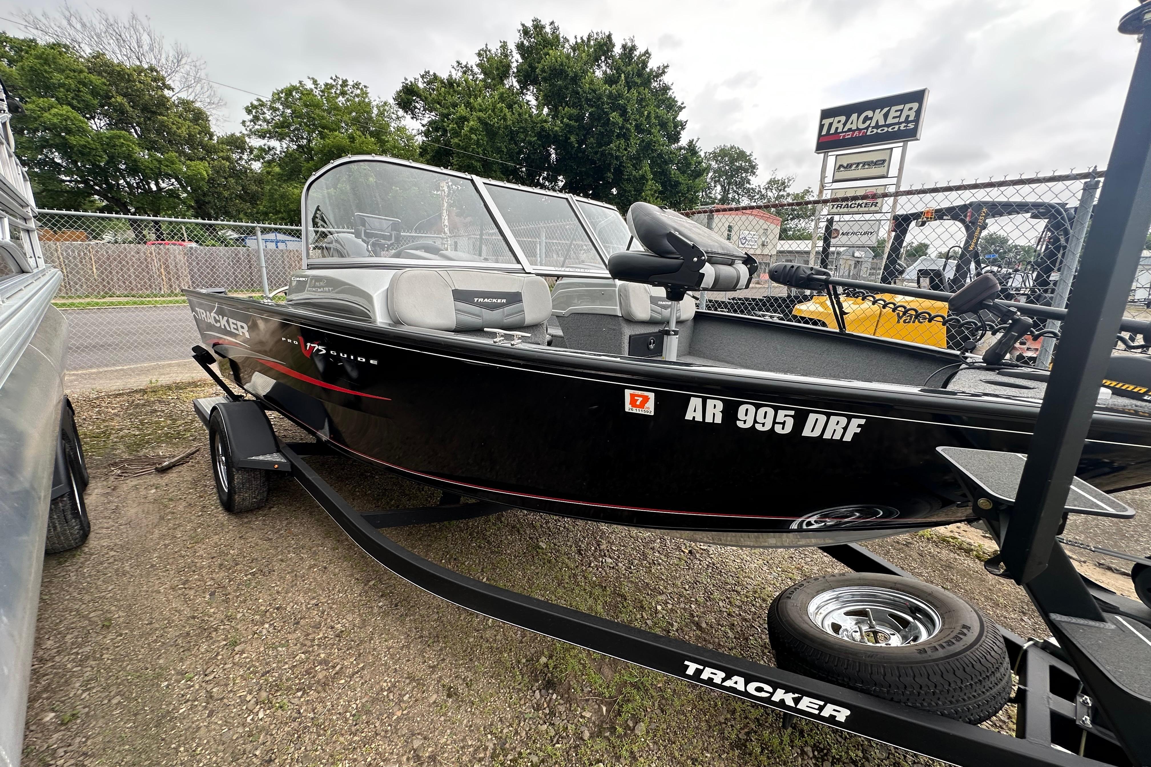 2018 Tracker Pro Guide V-175 Combo boat on trailer, parked outdoors.