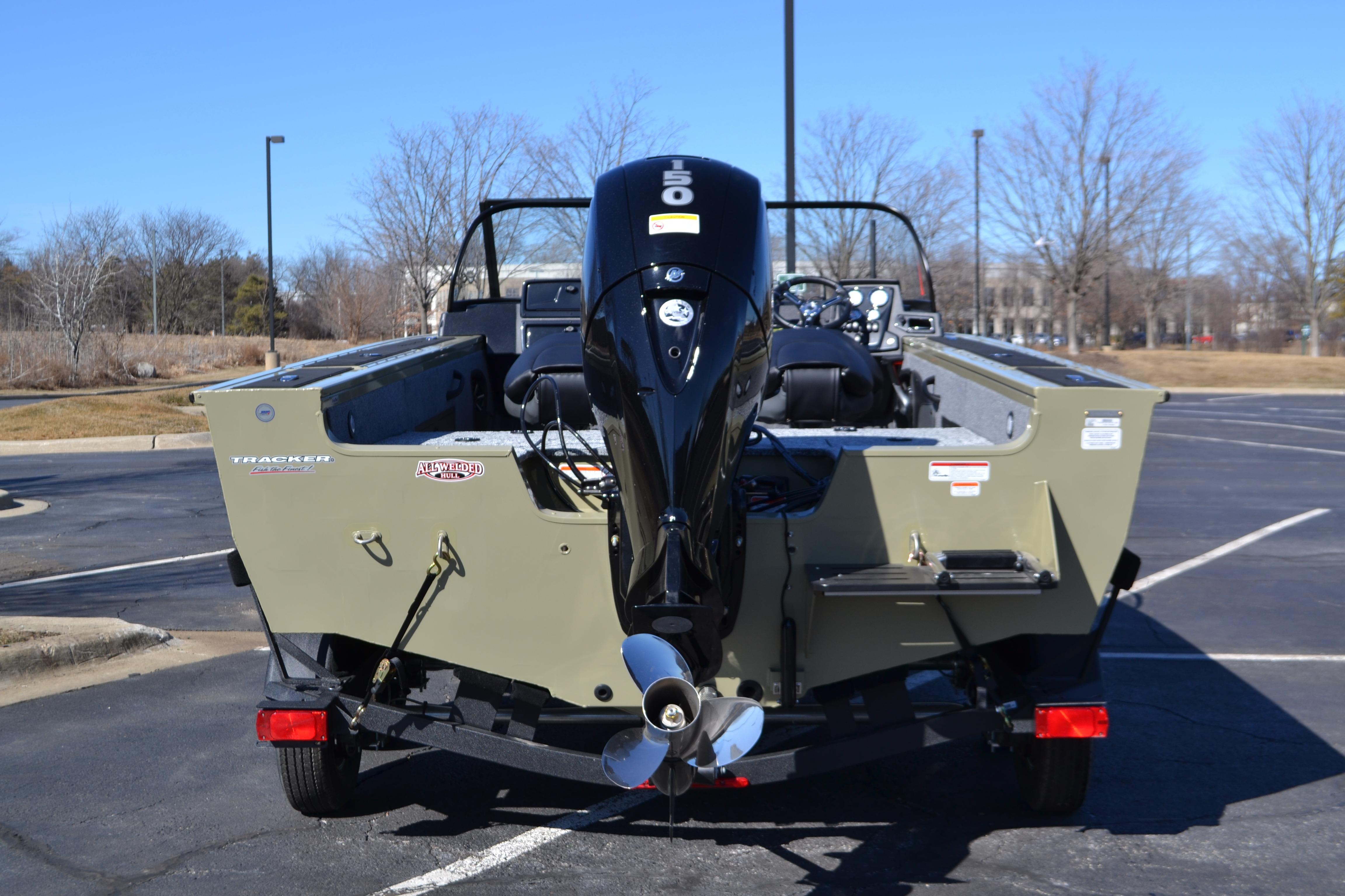 2026 Tracker Targa V-18 WT boat with powerful outboard motor in a parking lot.