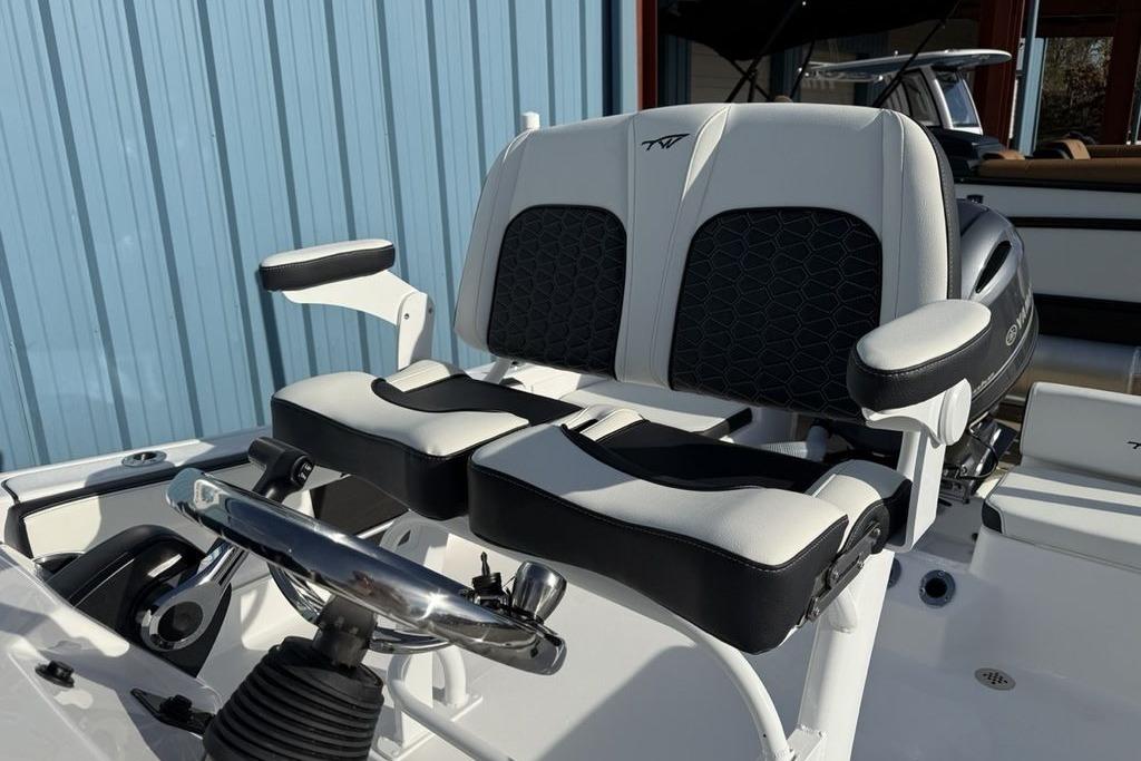 2026 Tidewater 198 CC Adventure boat seats with steering wheel, featuring modern design.