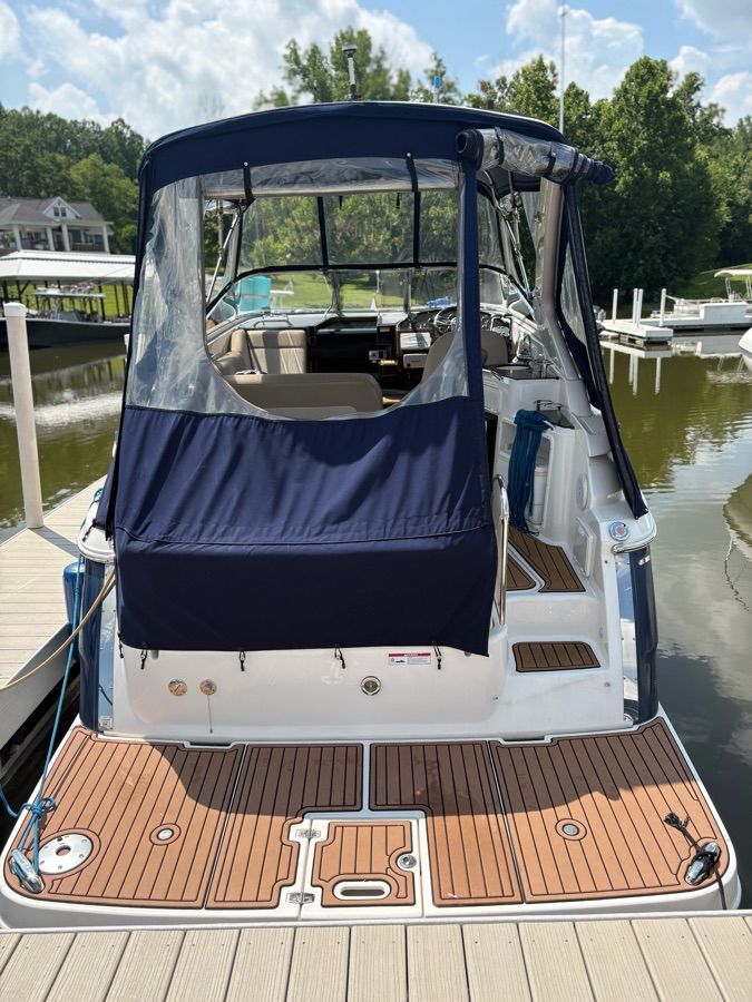 The image shows a 2014 Regal 30 Express boat docked at a marina.