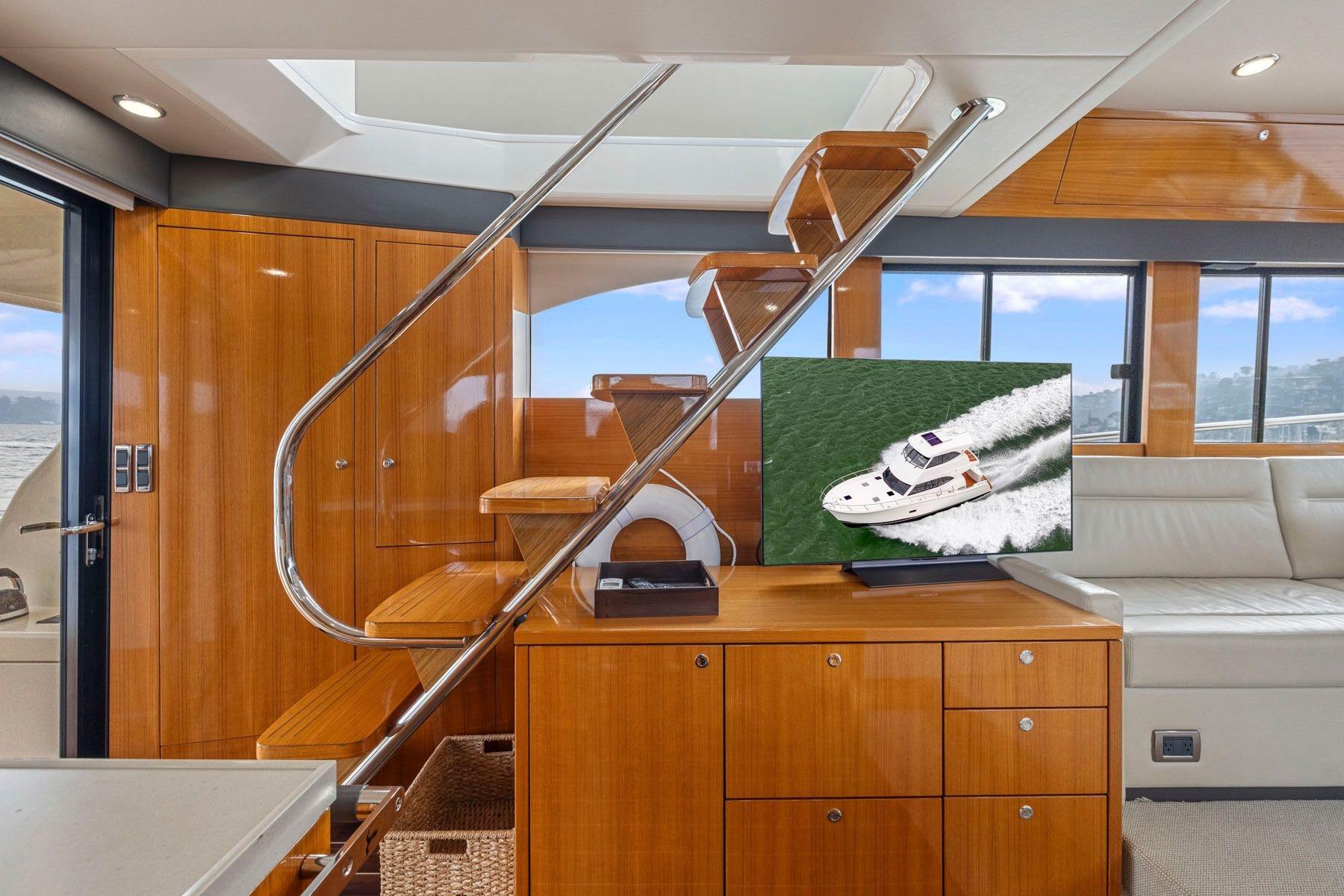 Luxurious 2014 Maritimo M50 yacht interior with sleek wooden finishes and modern design.