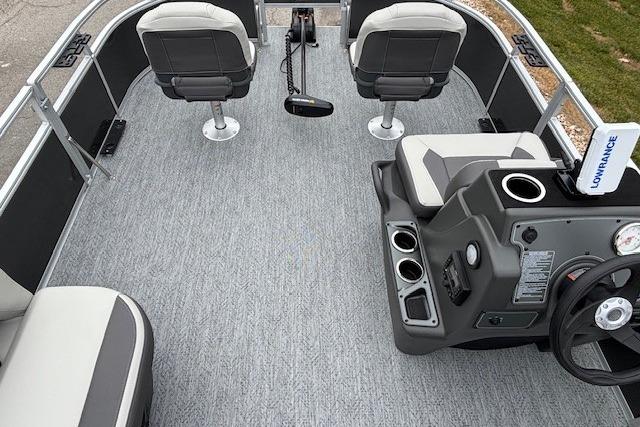 2026 Sun Tracker Bass Buggy 16 XL Select pontoon boat interior with seating and steering console.