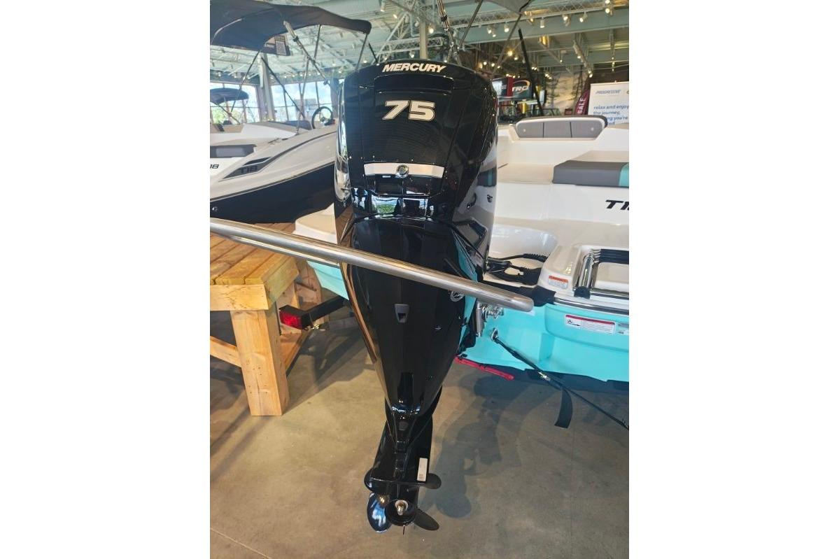 2026 Tahoe T16 boat with Mercury 75 outboard motor in showroom.