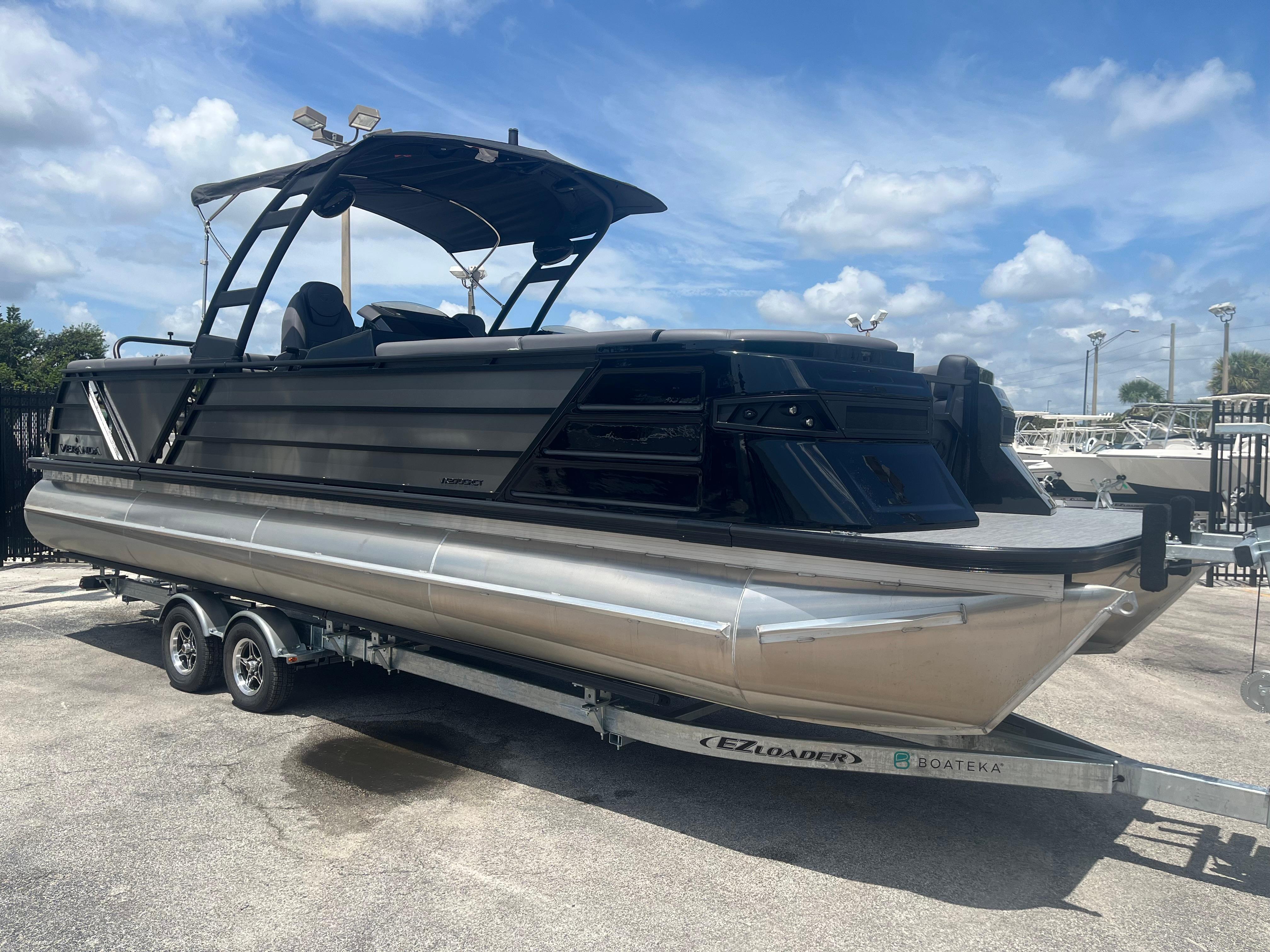2025 Veranda VX 27 DCRC pontoon boat on trailer under blue sky.
