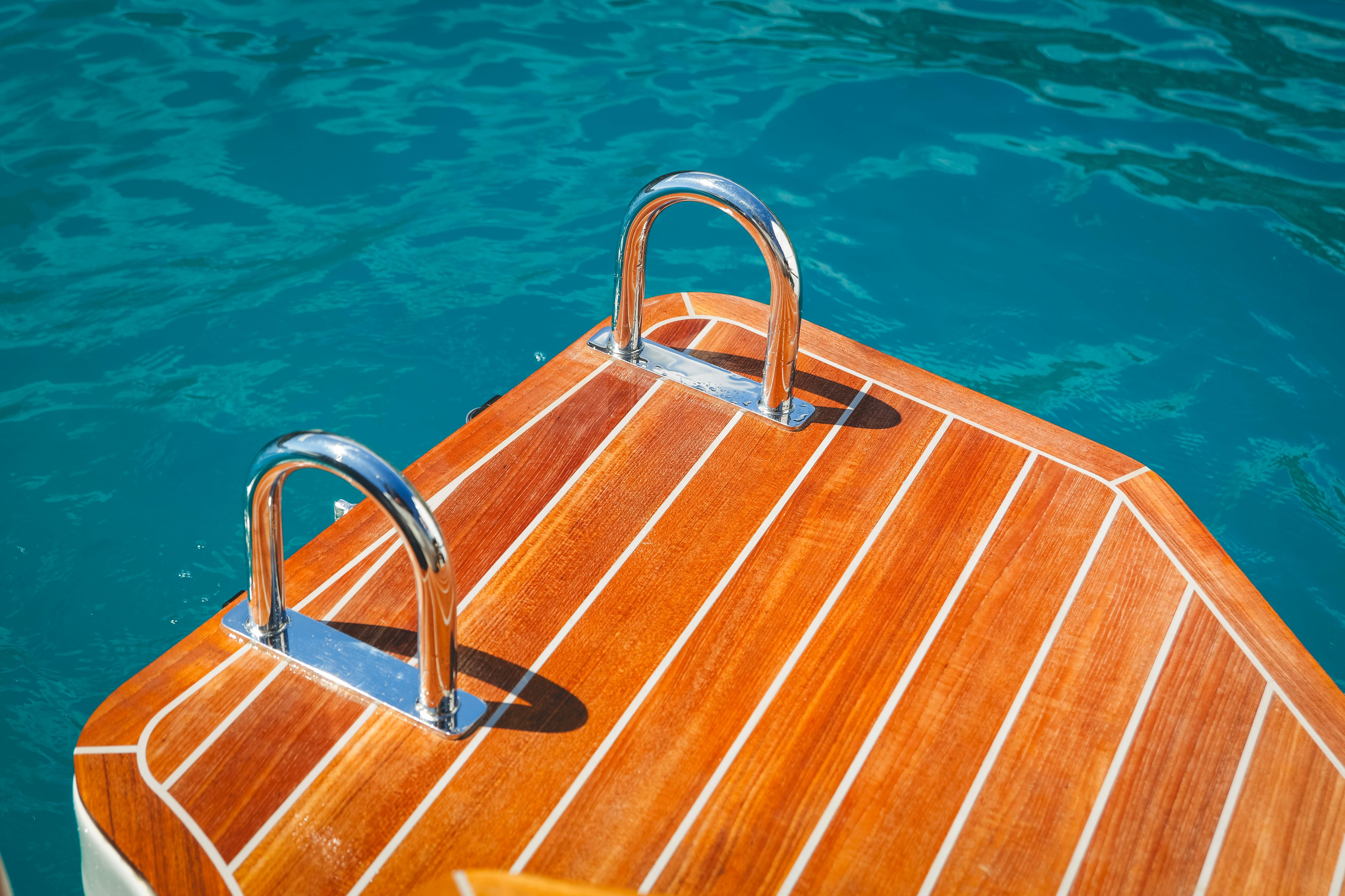 Teak deck of 2025 SACS STRIDER 11 OPEN BACK yacht on blue water.