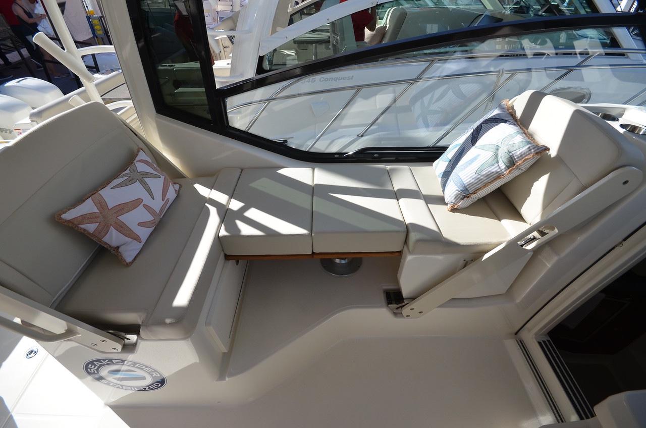 Manufacturer Provided Image: 2022 Boston Whaler 325 Conquest interior seating area with cushions and pillows.