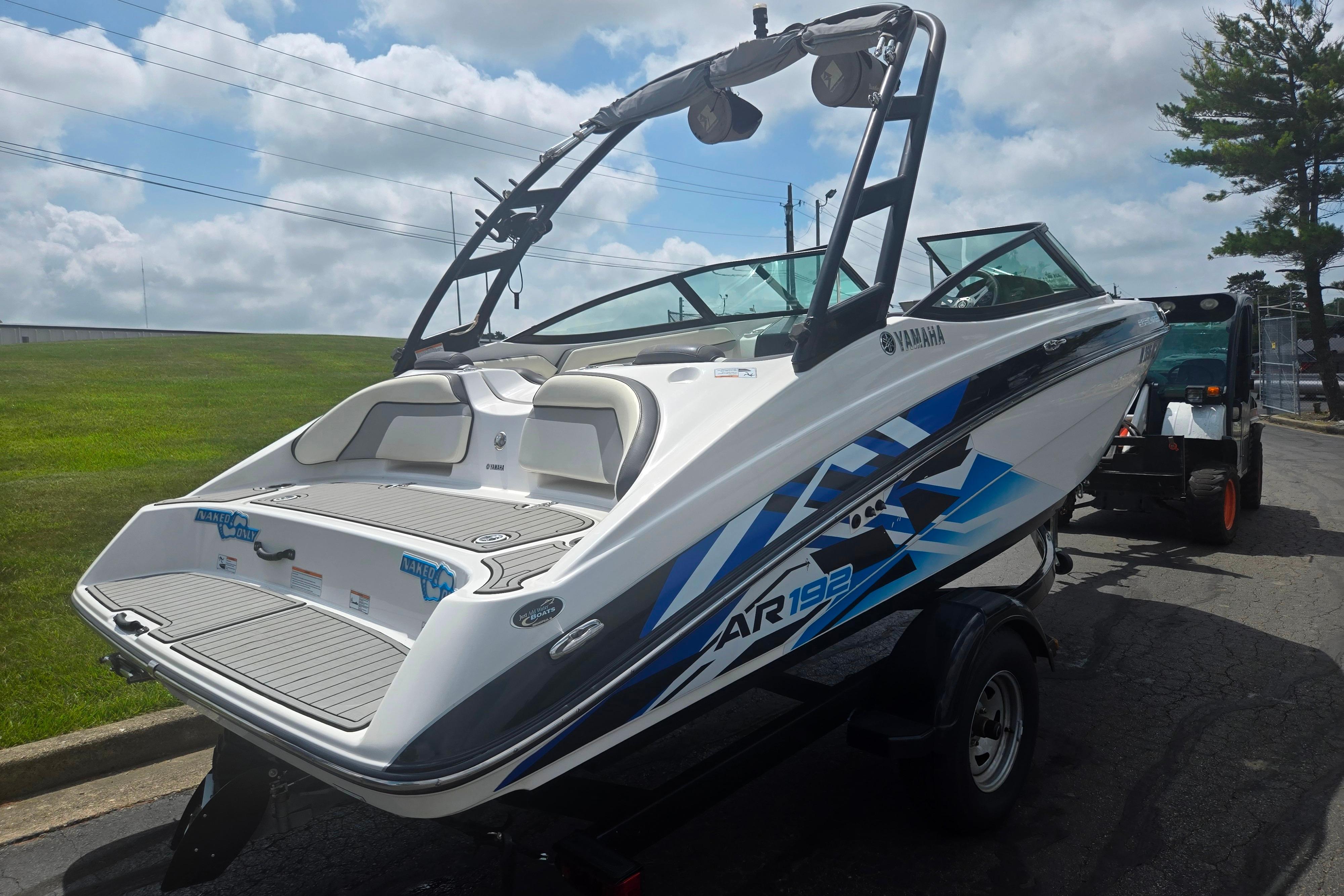 2016 Yamaha Boats AR192 on trailer, sleek design, vibrant graphics, outdoor setting.