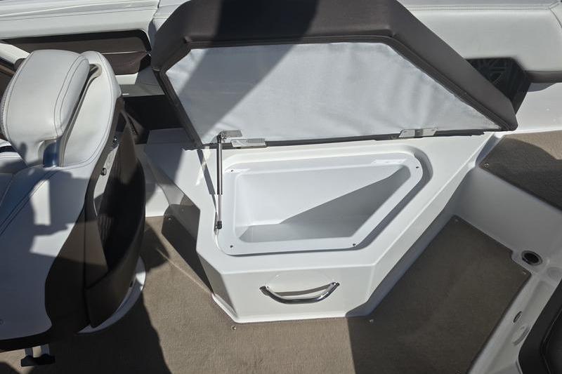 Open storage compartment in 2022 Cobalt R4 boat interior.