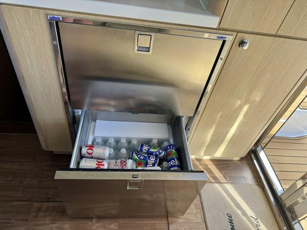 Stainless steel drawer fridge on Aquila 44 yacht, stocked with drinks, 2022 model.