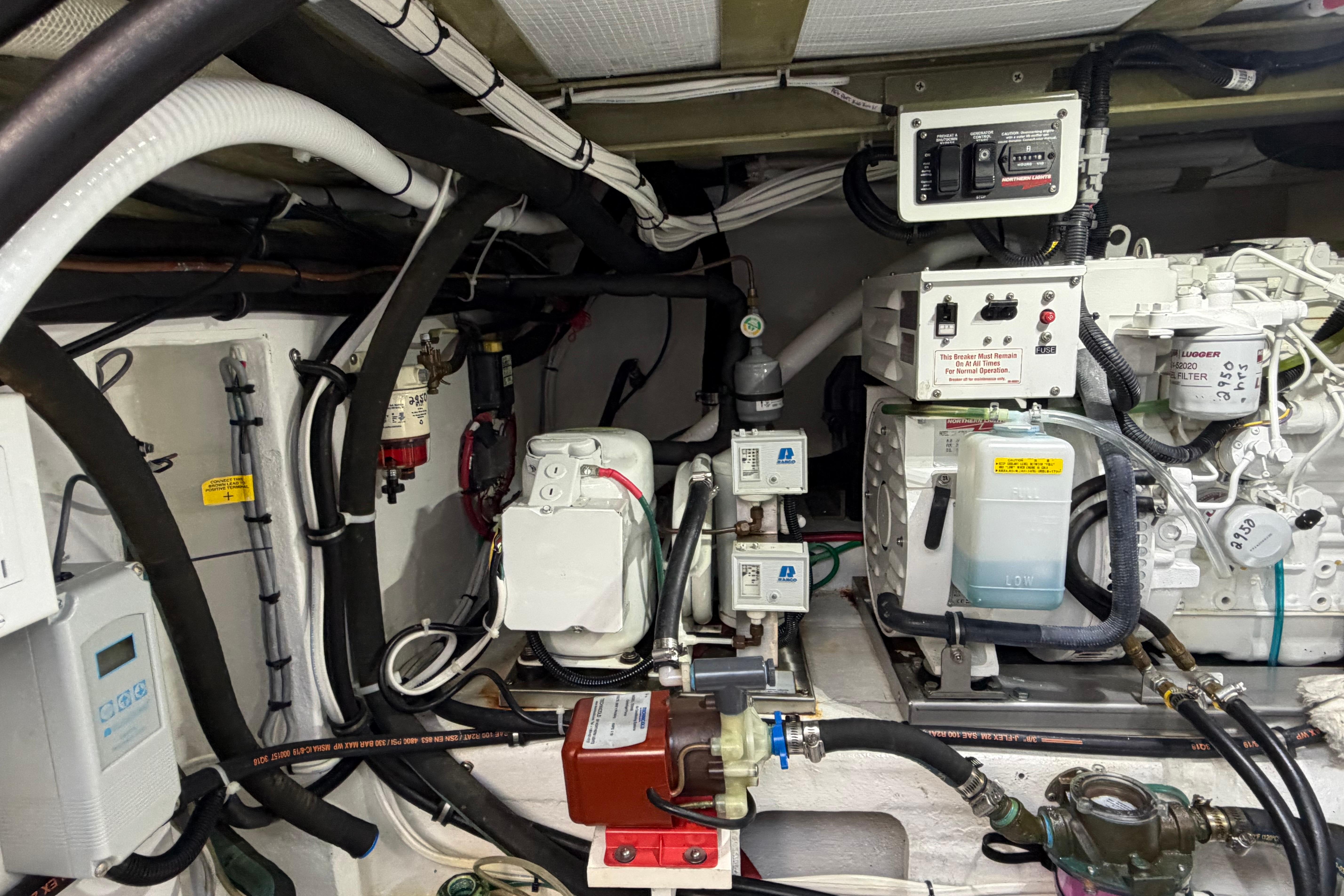 Engine room of a 2018 H&H Marine Osmond Beal boat, showcasing mechanical components and wiring.