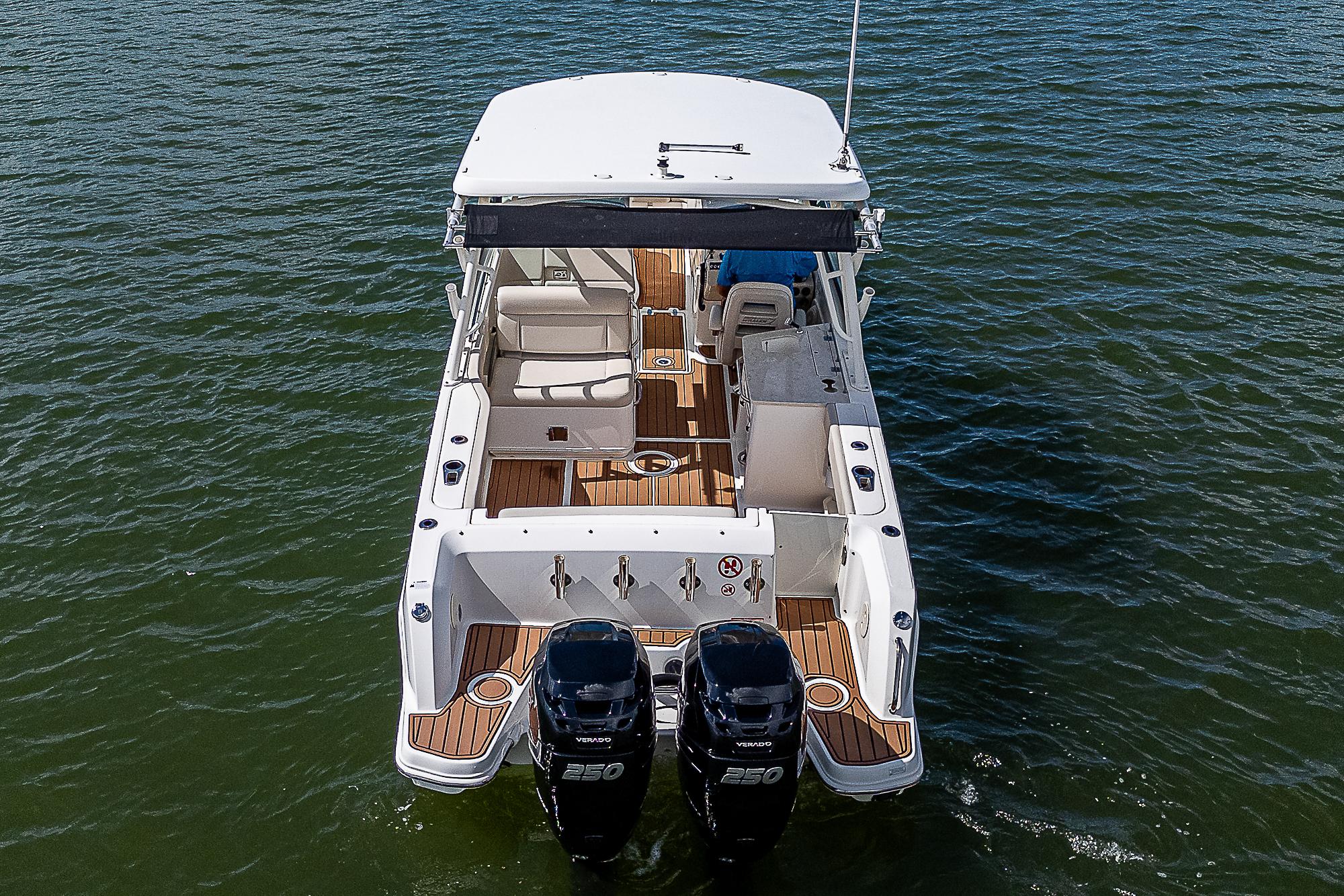 2018 Boston Whaler 270 Vantage boat with dual engines on water.