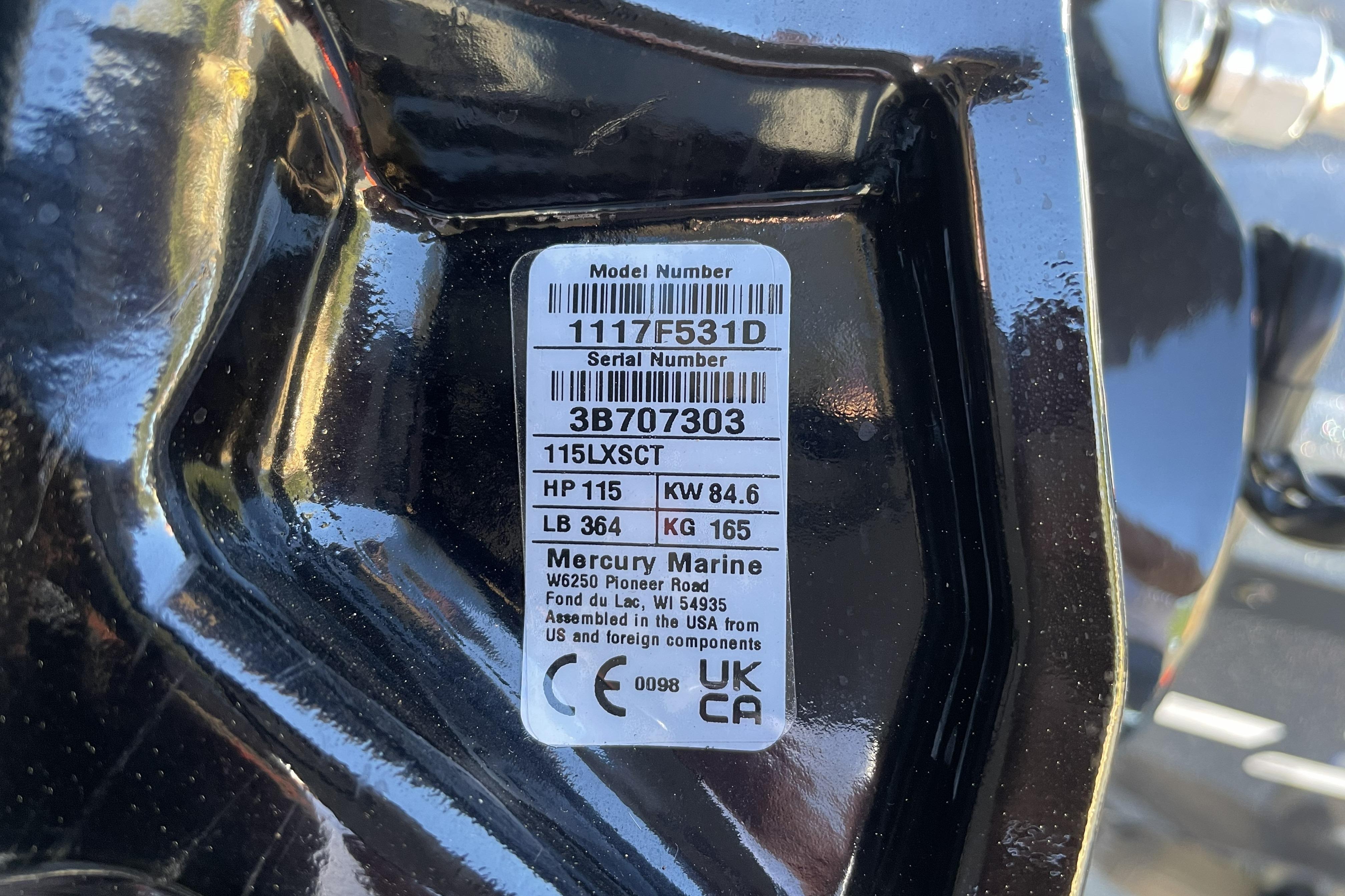 Label on Mercury Marine engine, model 115LXSCT, 115 HP, assembled in USA.