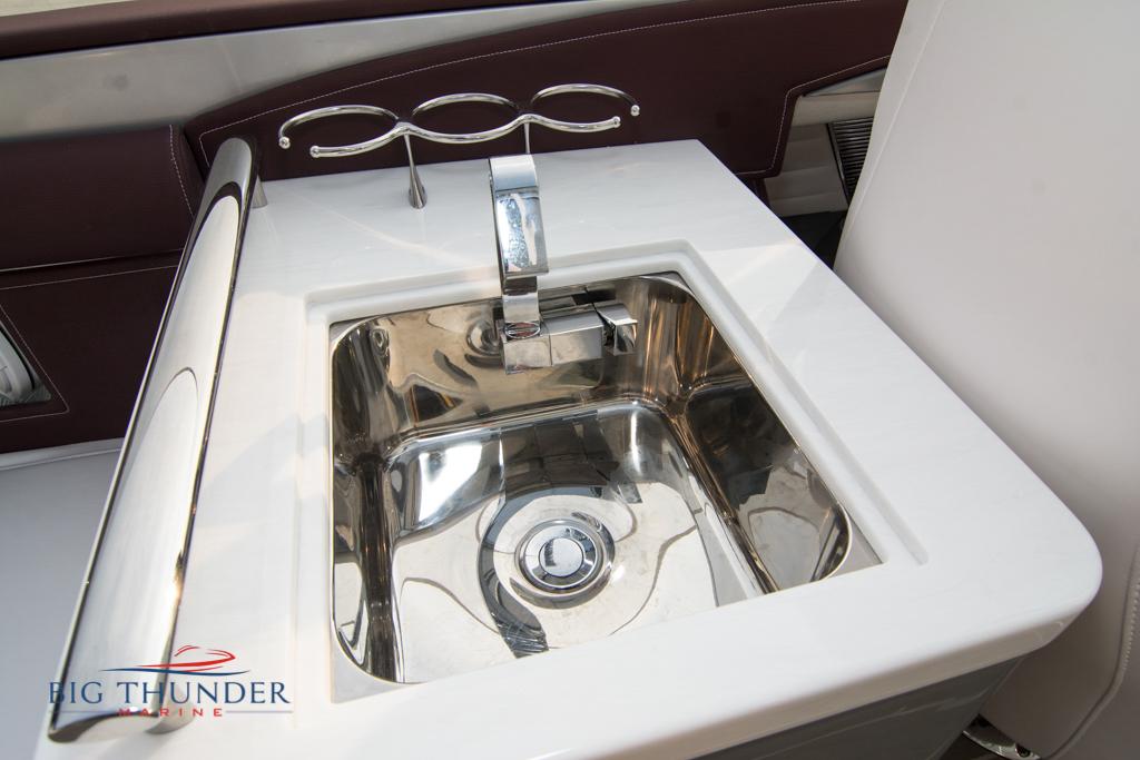 2019 Donzi 41 GT boat sink with modern faucet and Big Thunder Marine logo.