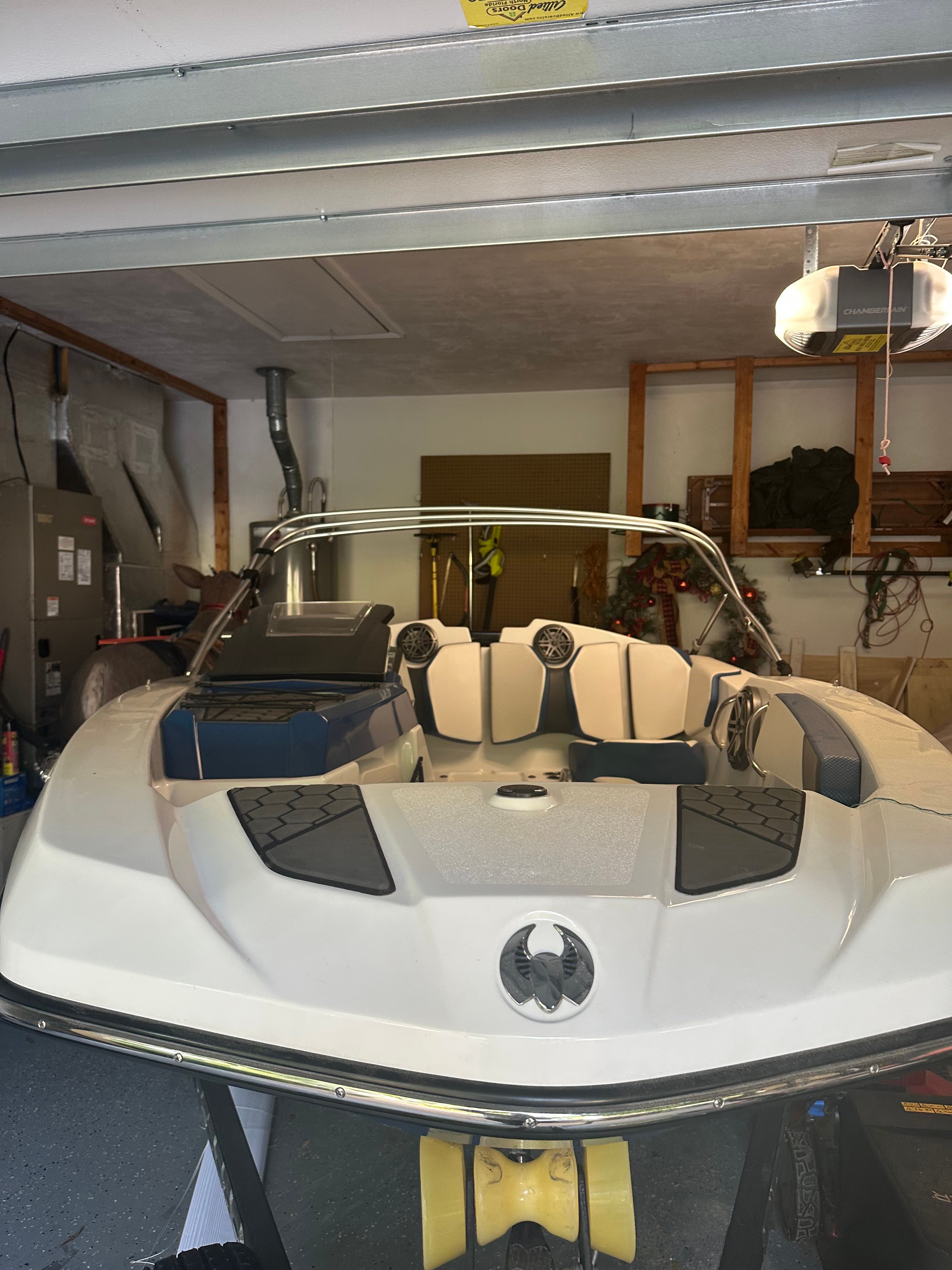 2023 Scarab Identity Jet boat parked in a garage.