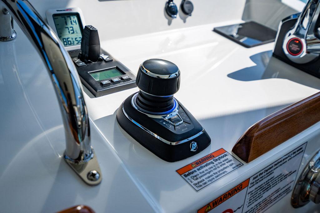 2024 MJM 4 boat control panel with joystick and instrument display.