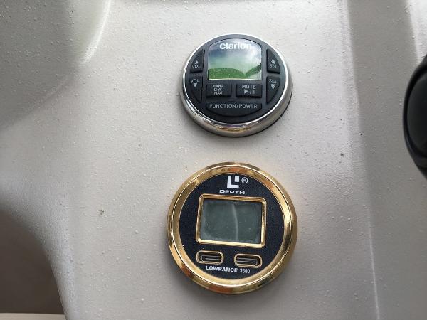 2004 Cruisers Yachts 3372 Express dashboard with Clarion and Lowrance instruments.