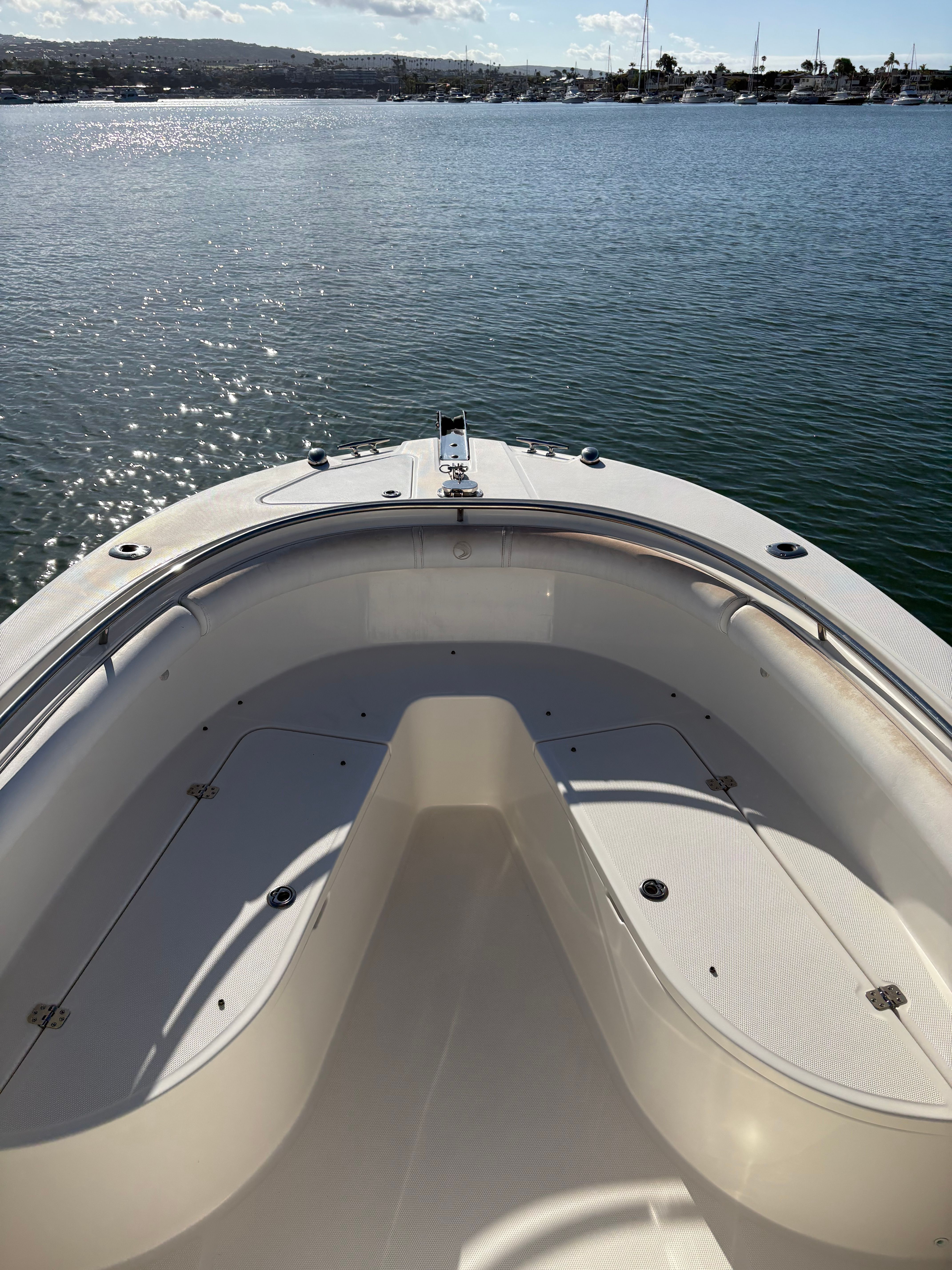 Edgewater 228CC 2008 boat on calm water under sunny skies.