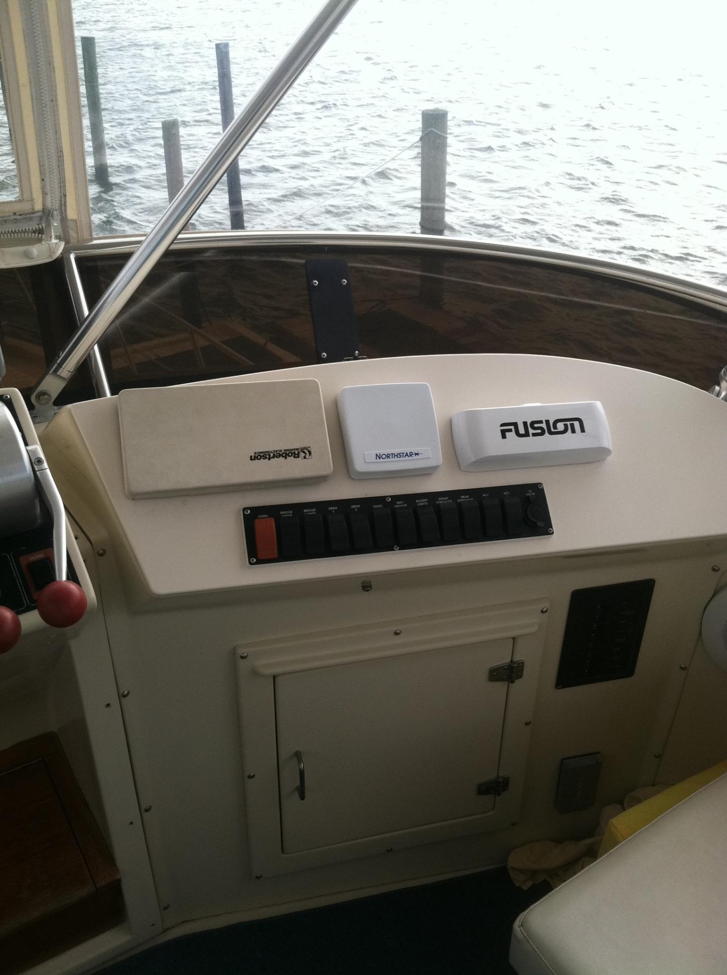 1989 Californian 48 Motor Yacht dashboard with marine electronics and controls.