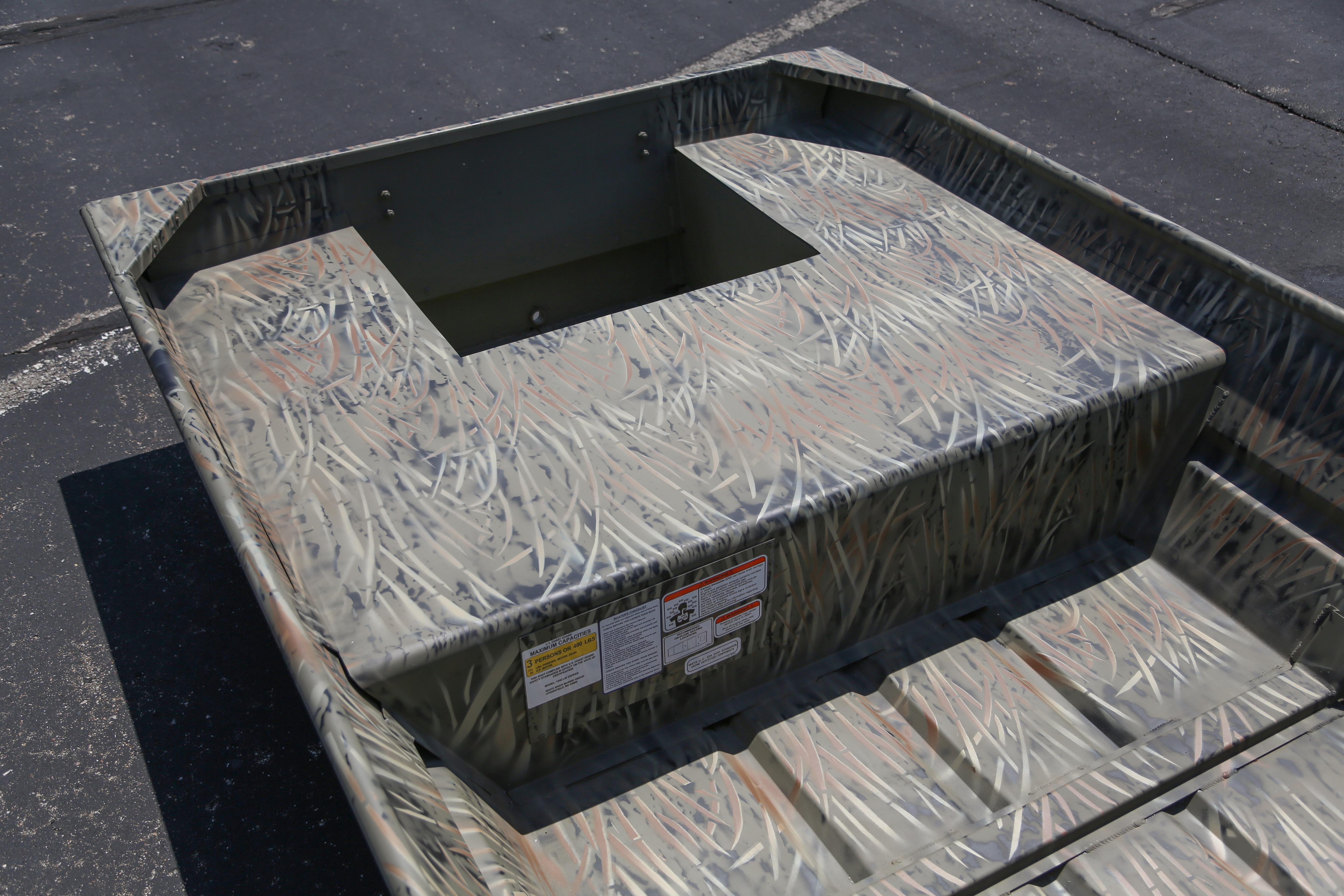 2026 Tracker Grizzly 15 Jon boat with camouflage pattern on a paved surface.