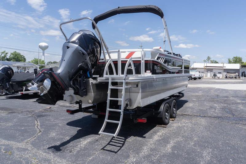 2026 SunCatcher Select 322SL pontoon boat on trailer, featuring powerful outboard motor.