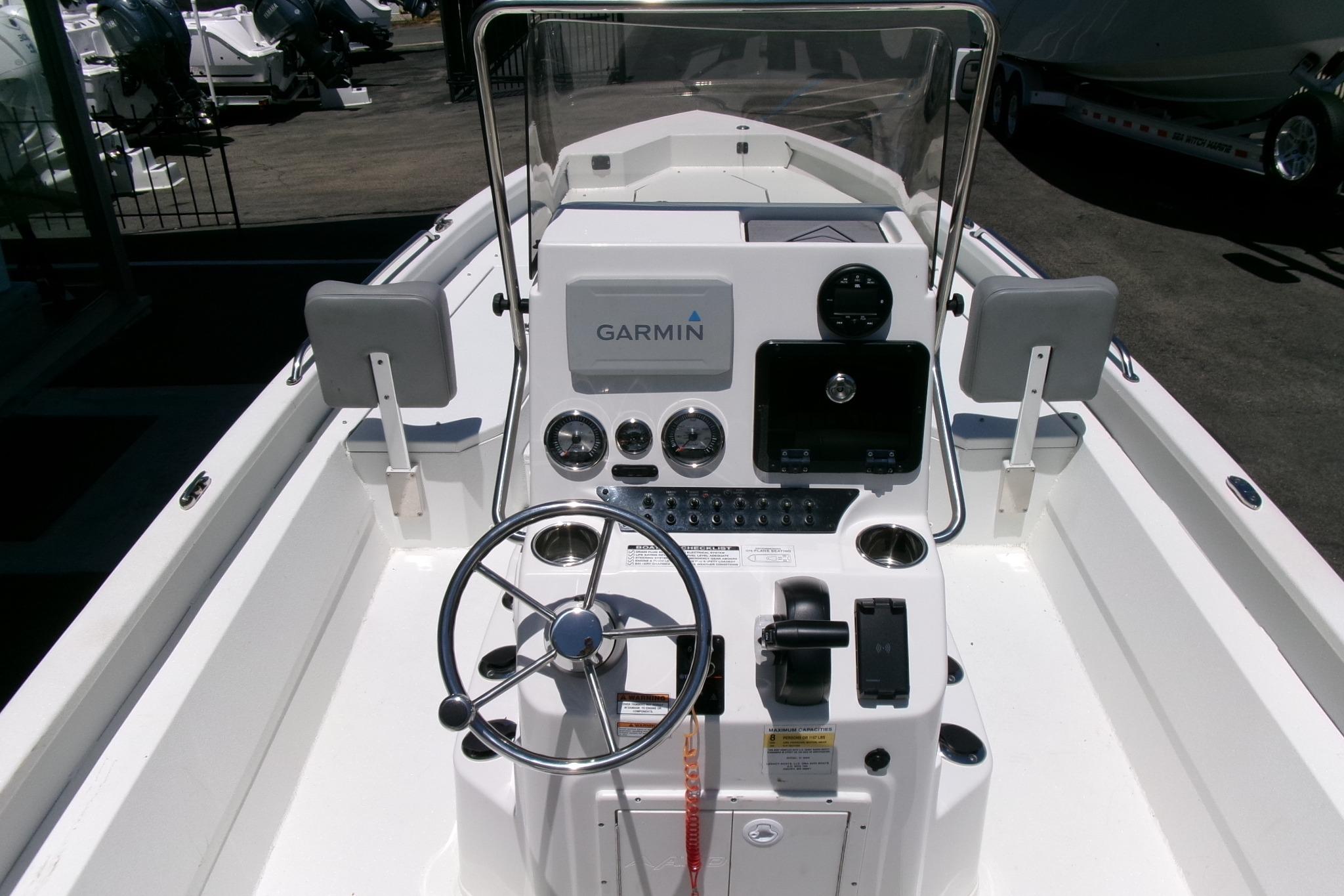 2022 Avid 21 Fusion boat dashboard with Garmin navigation system and steering wheel.