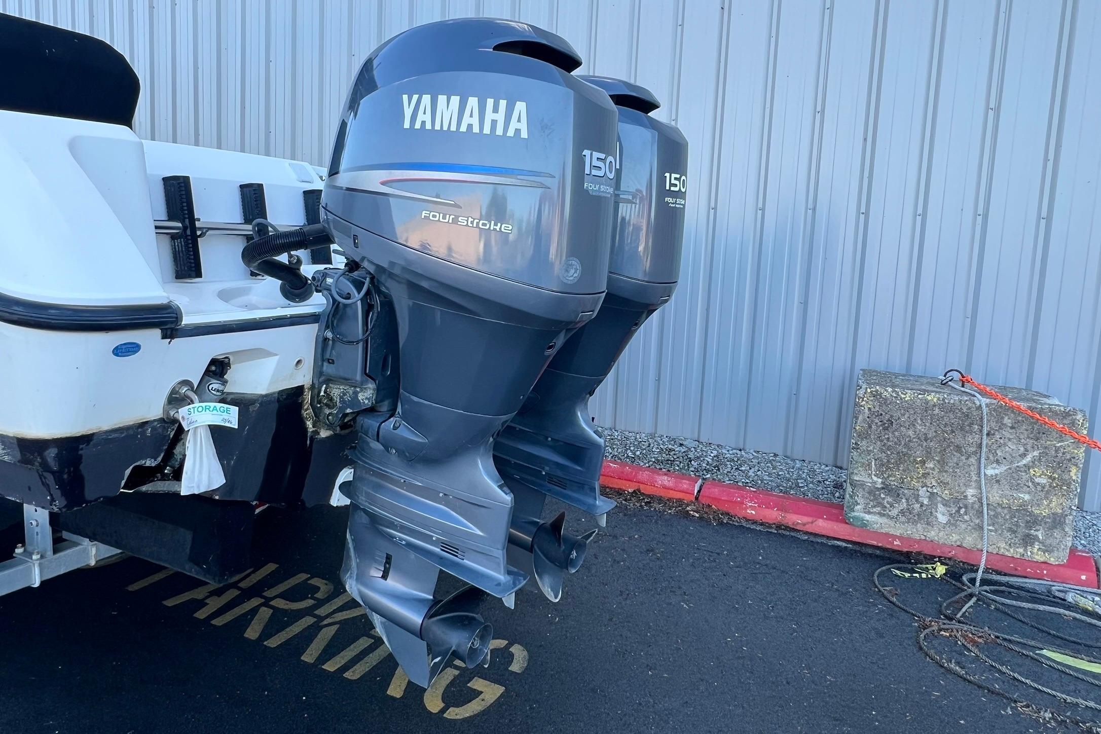 Twin Yamaha 150 horsepower four-stroke outboard motors on a 2006 Edgewater 245CC boat.