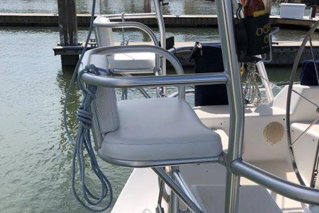 Sailboat cockpit with cushioned seat, Freedom 35 model, docked at marina, 1995.