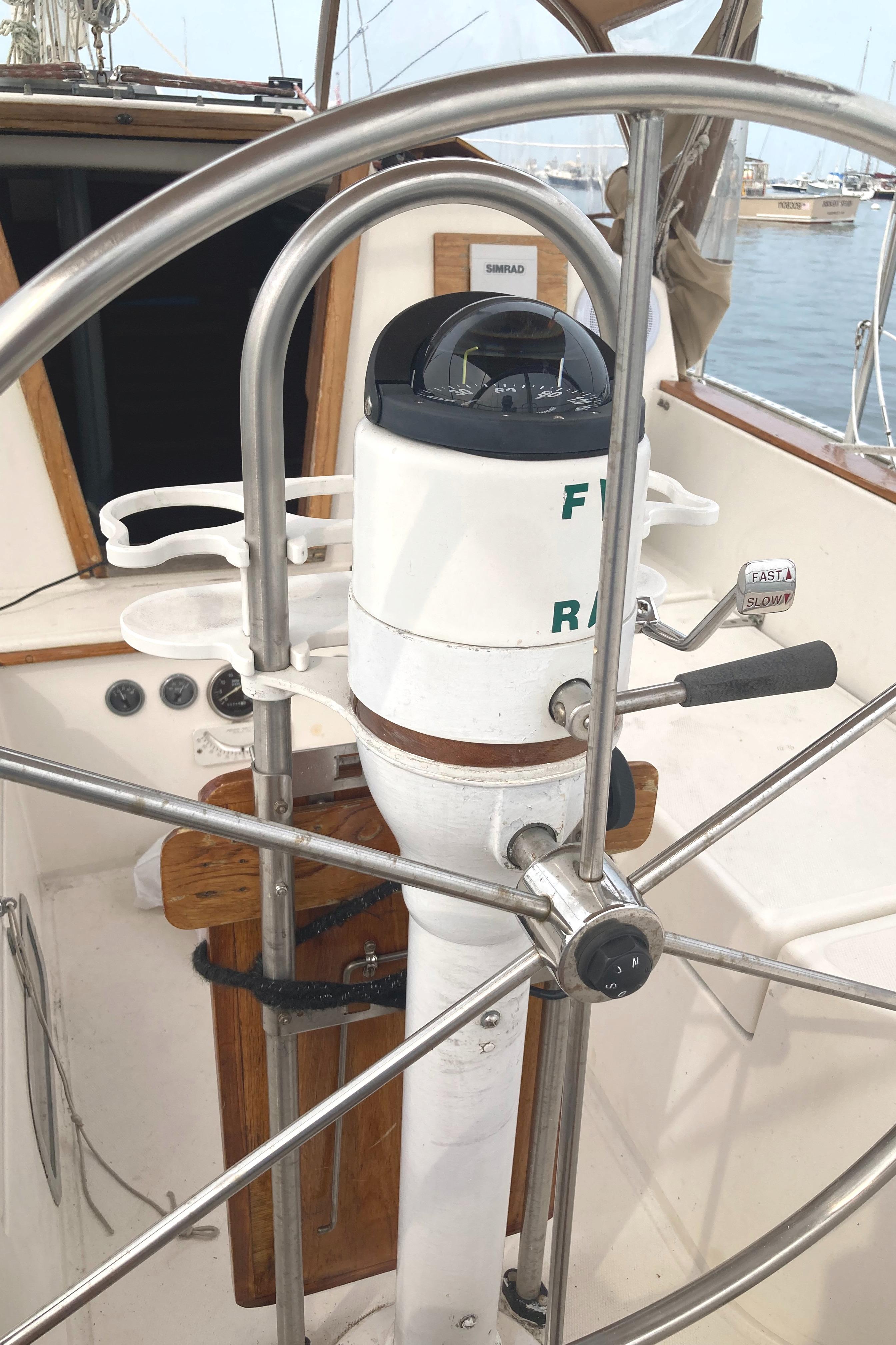 1981 Sabre 34 sailboat helm with compass and stainless steel wheel.