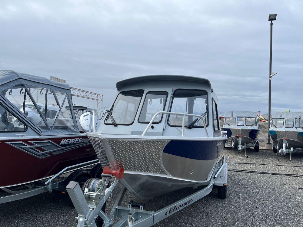 2024 Hewescraft 200 ProV ET HT boat on trailer, displayed outdoors.