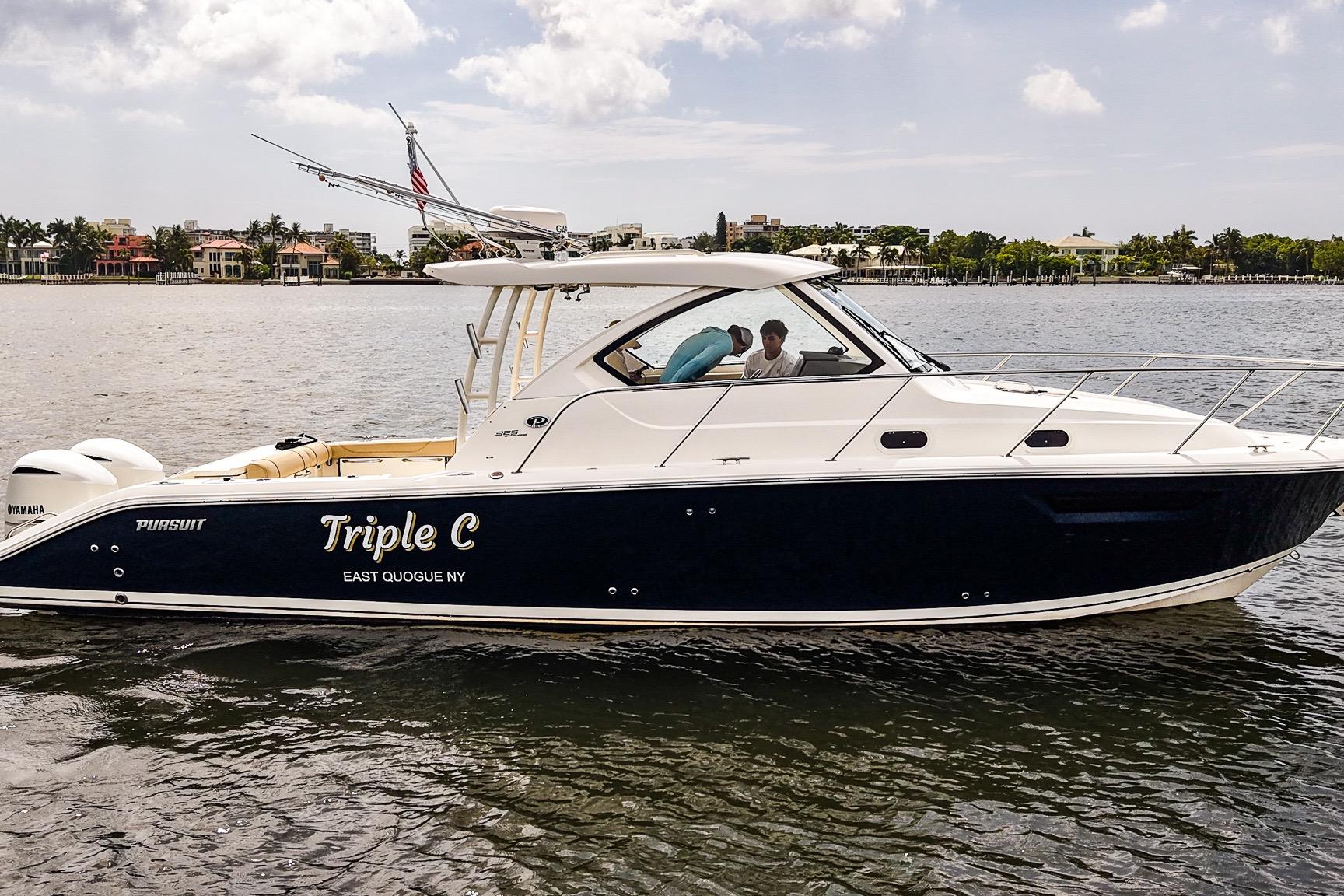 2020 Pursuit OS 325 Offshore boat named "Triple C" on calm waters near East Quogue, NY.