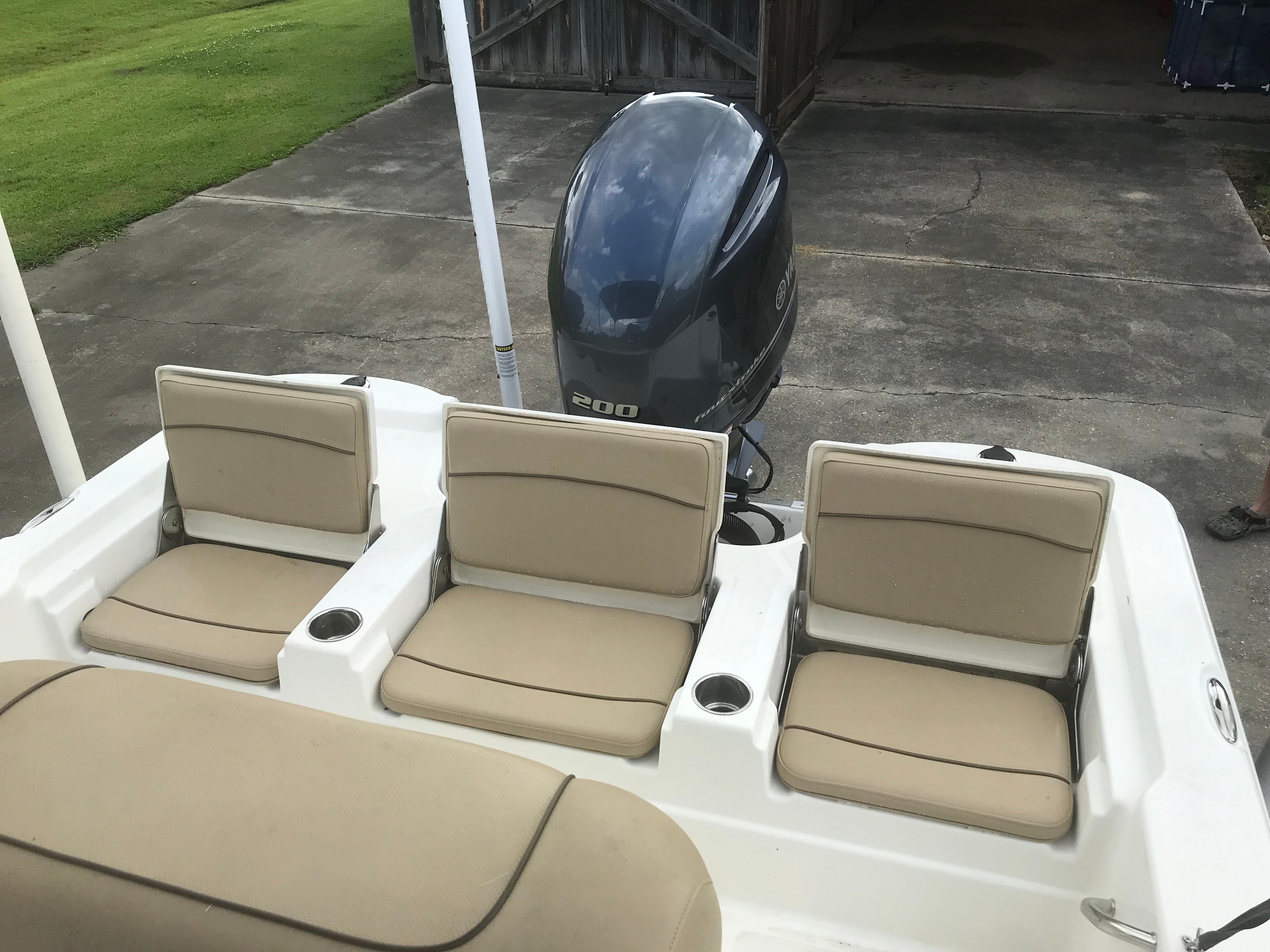 Rear view of 2020 NauticStar 215 XTS with three seats.