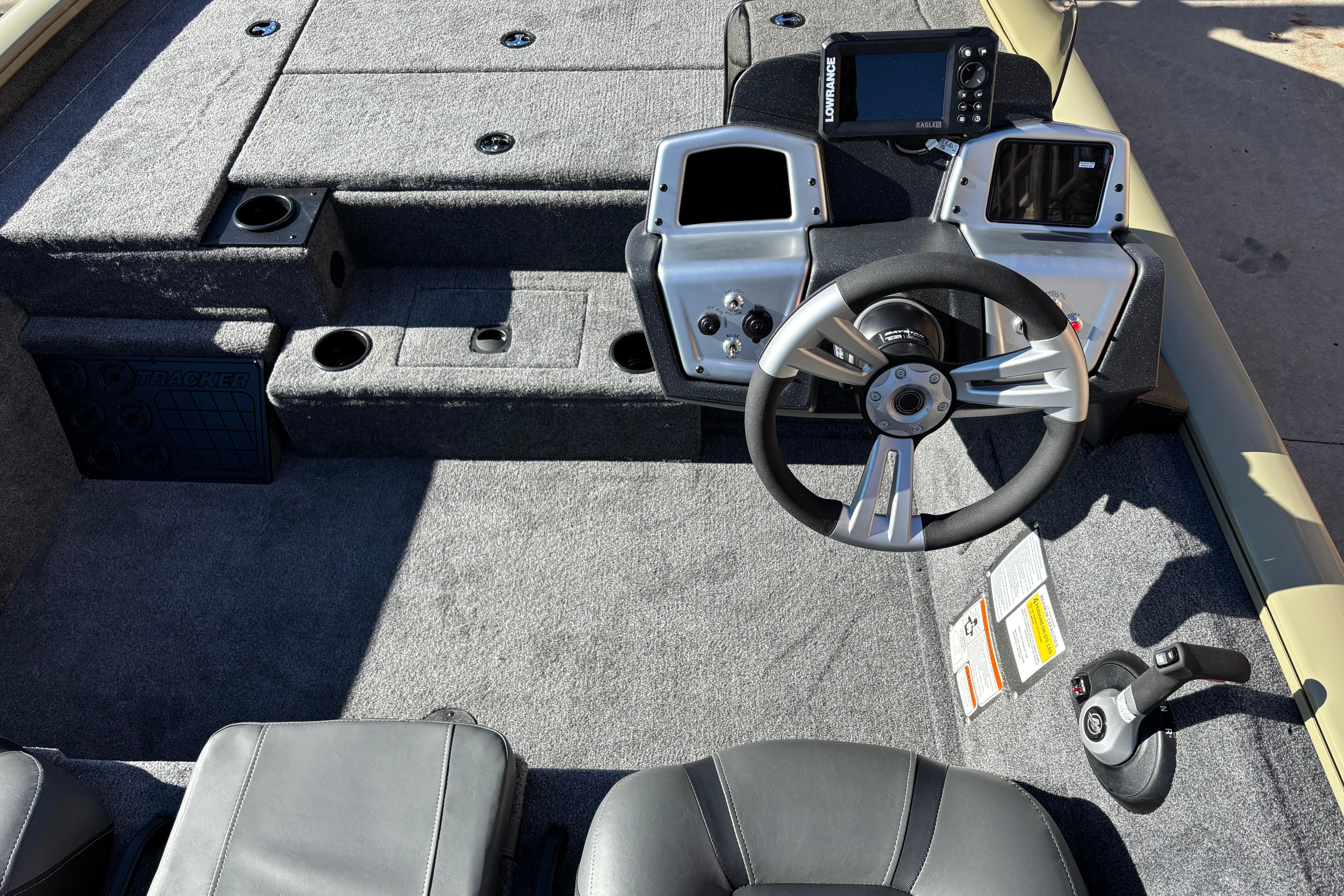 2026 Tracker Pro Team 195 boat interior with steering wheel and control panel.
