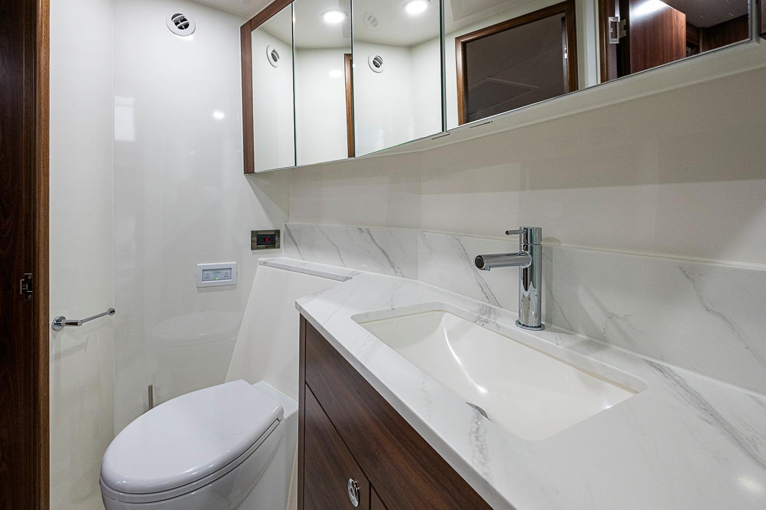 Luxurious bathroom in 2026 Maritimo M50 yacht with modern fixtures and elegant design.